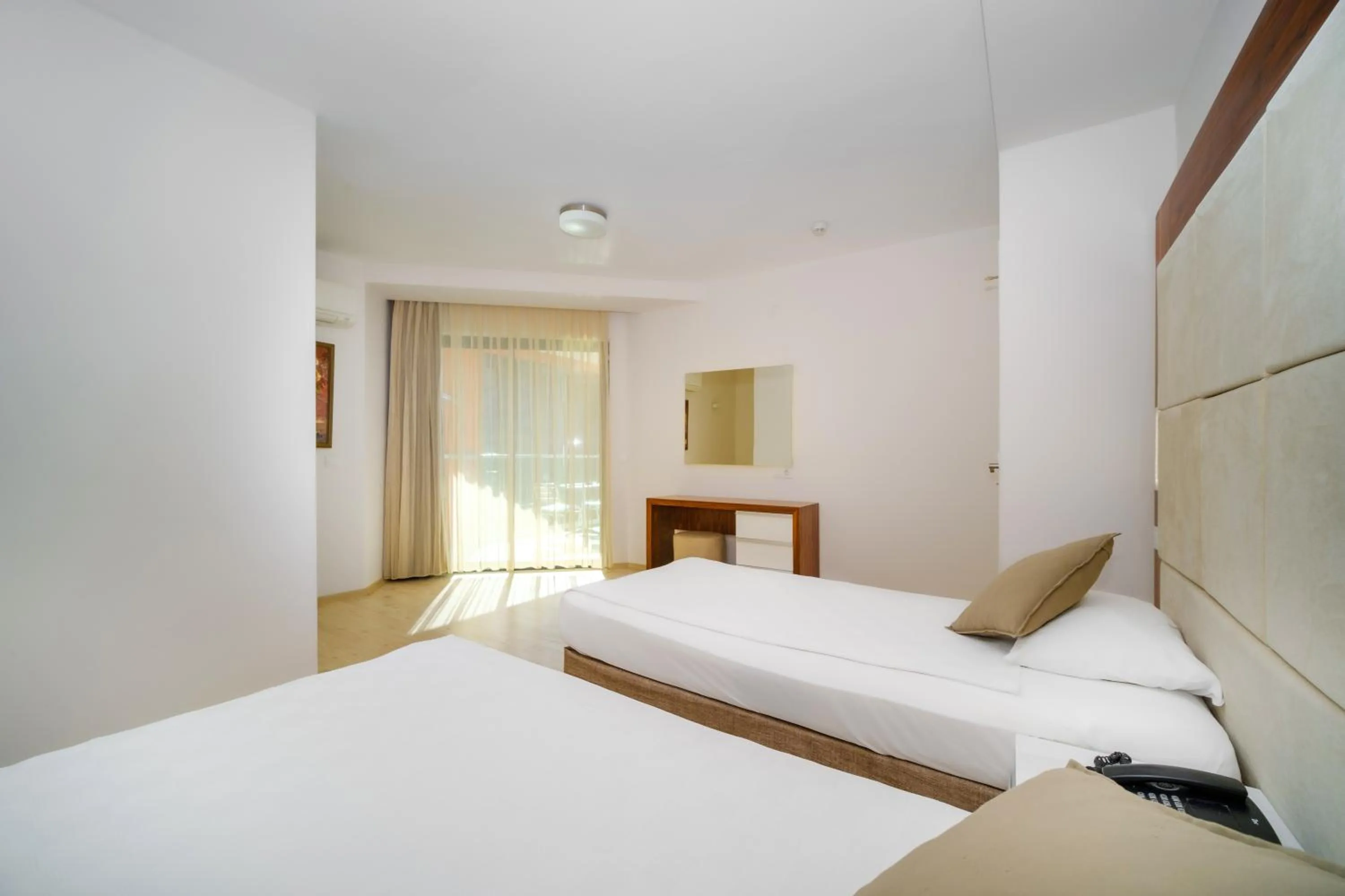 Bed in Delfino Apart Hotel