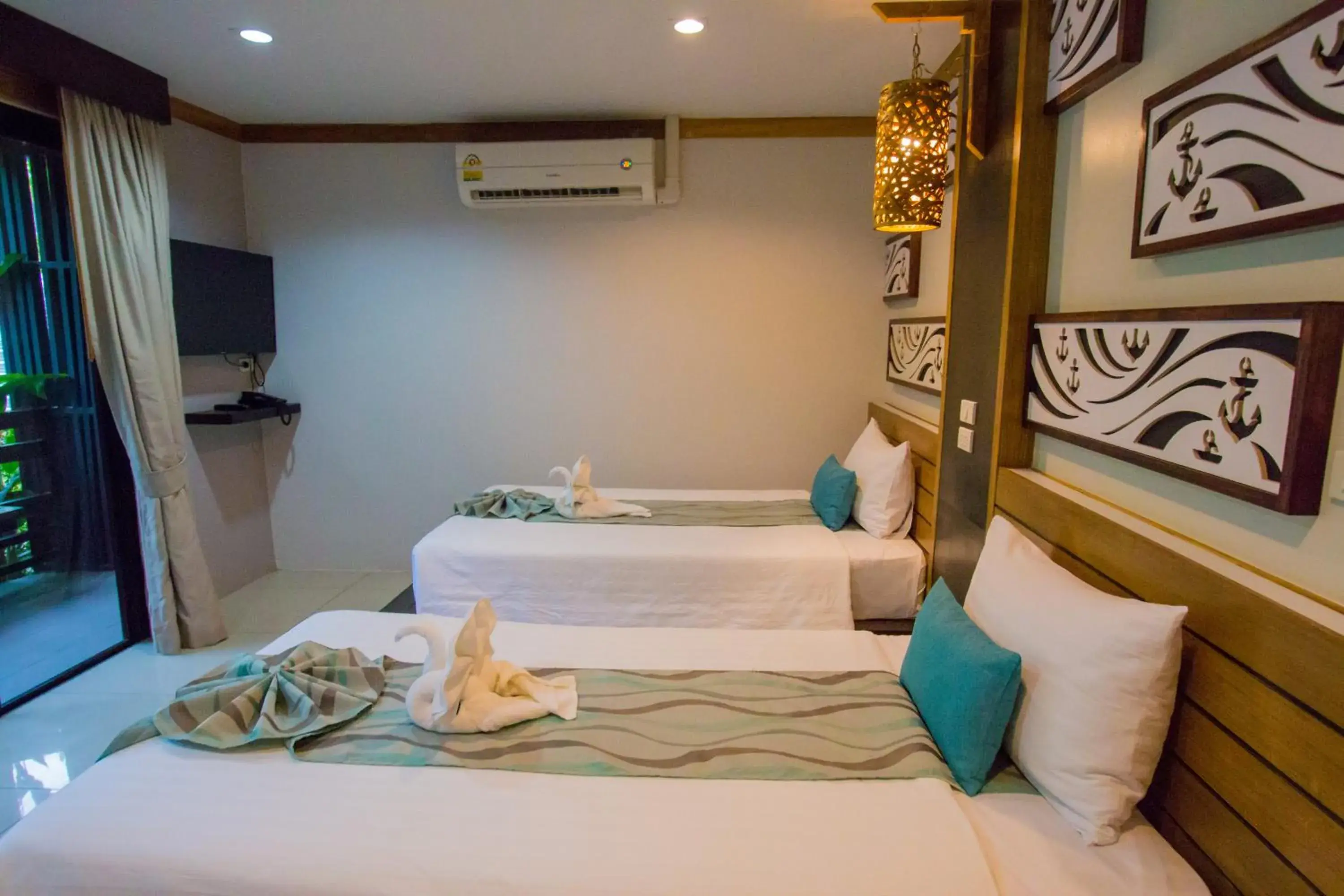 Bed in ChaoKoh Phi Phi Hotel and Resort- SHA Extra Plus Bed in ChaoKoh Phi Phi Hotel and Resort- SHA Extra Plus