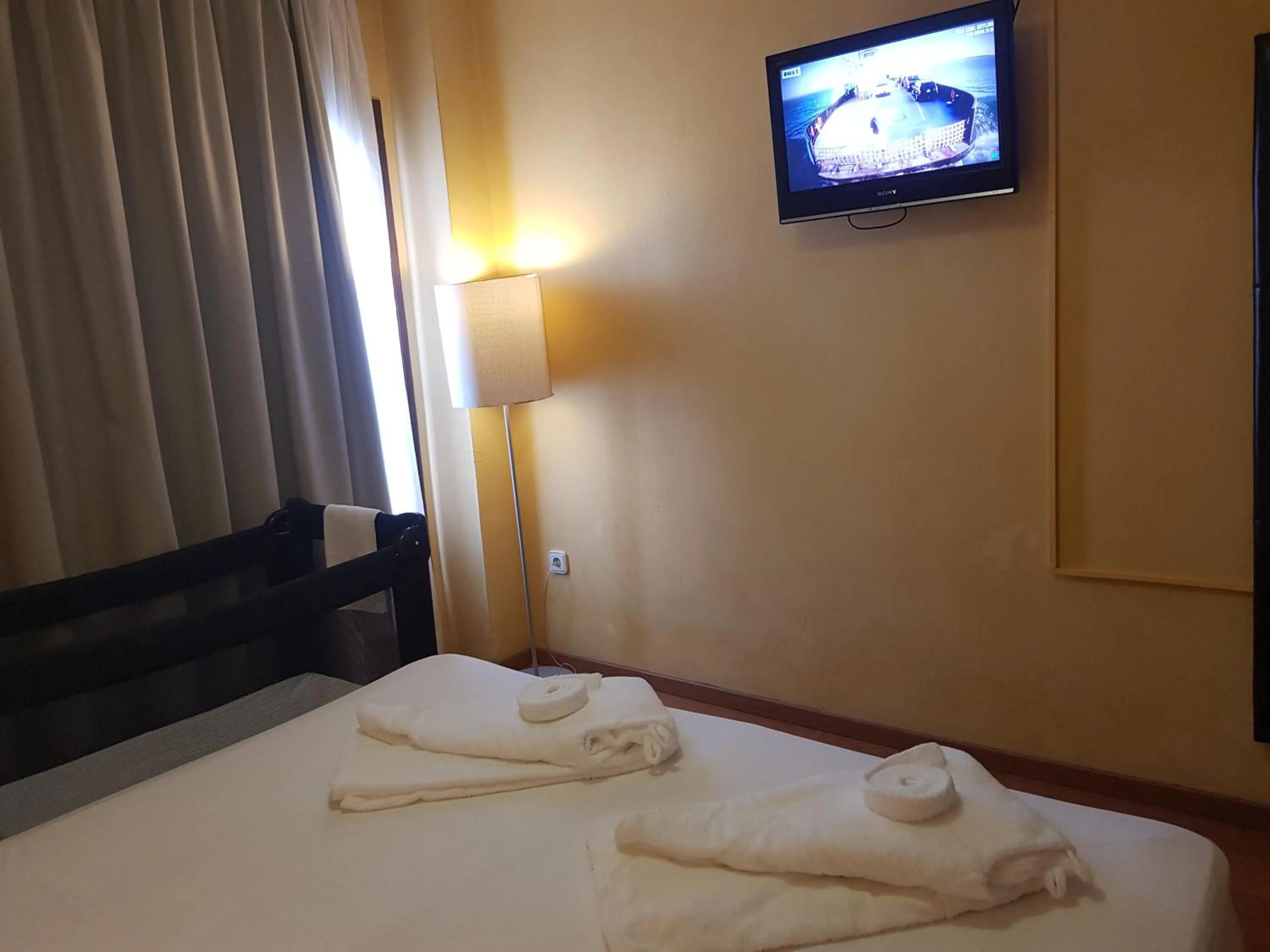 Bed in Apartamentos Parot Quality