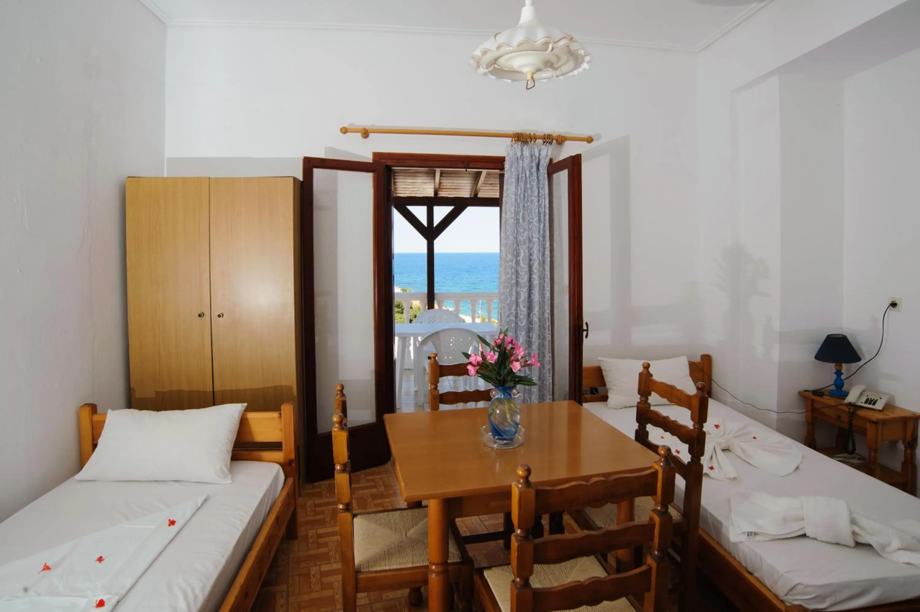 Dining area, Bed in Athina Studios