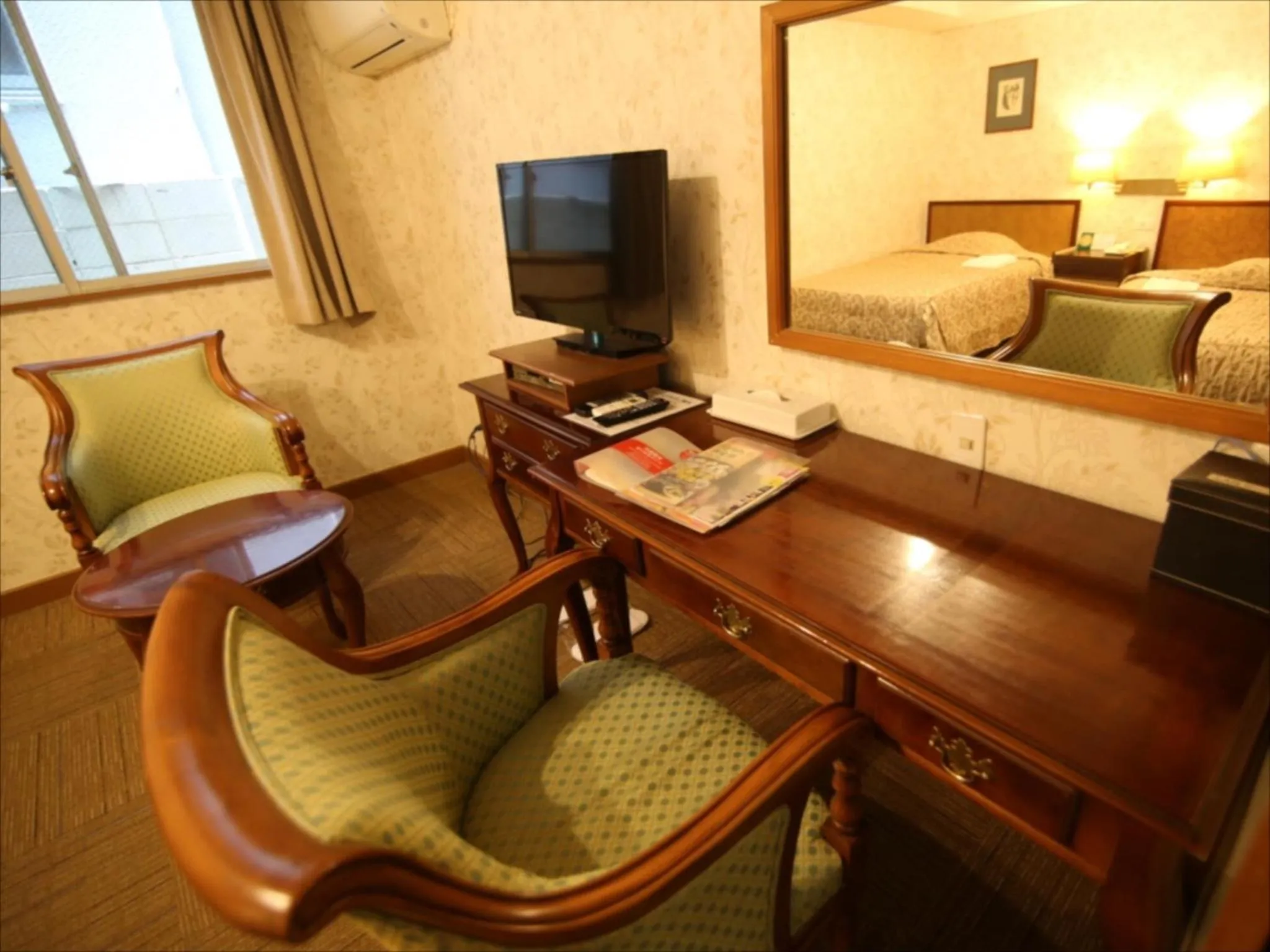 Photo of the whole room in Sunrise Hotel Okinawa-どこか懐かしいレトロ宿軽朝食付