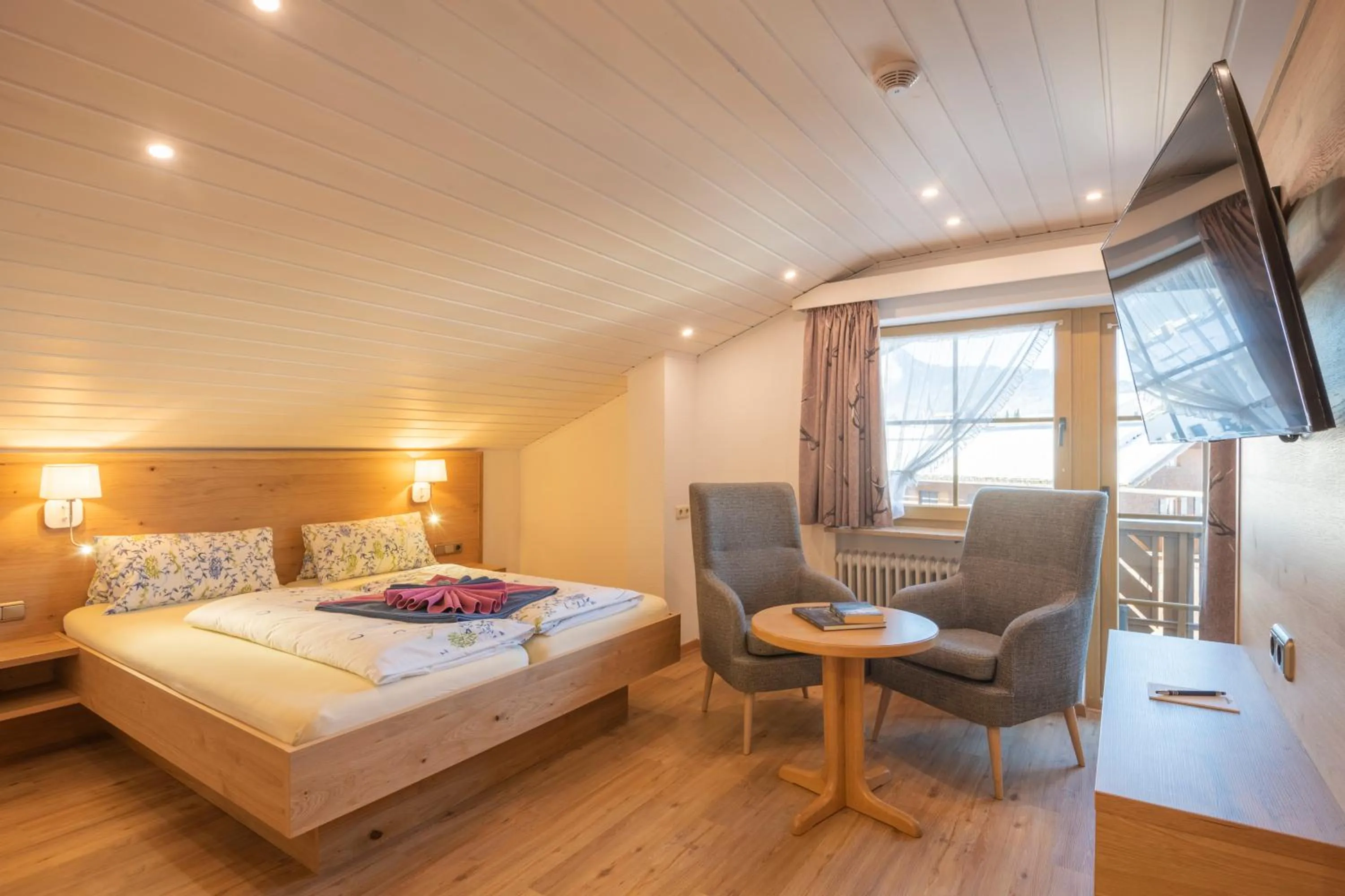 Seating area, Bed in Ferienhotel Sonnenheim