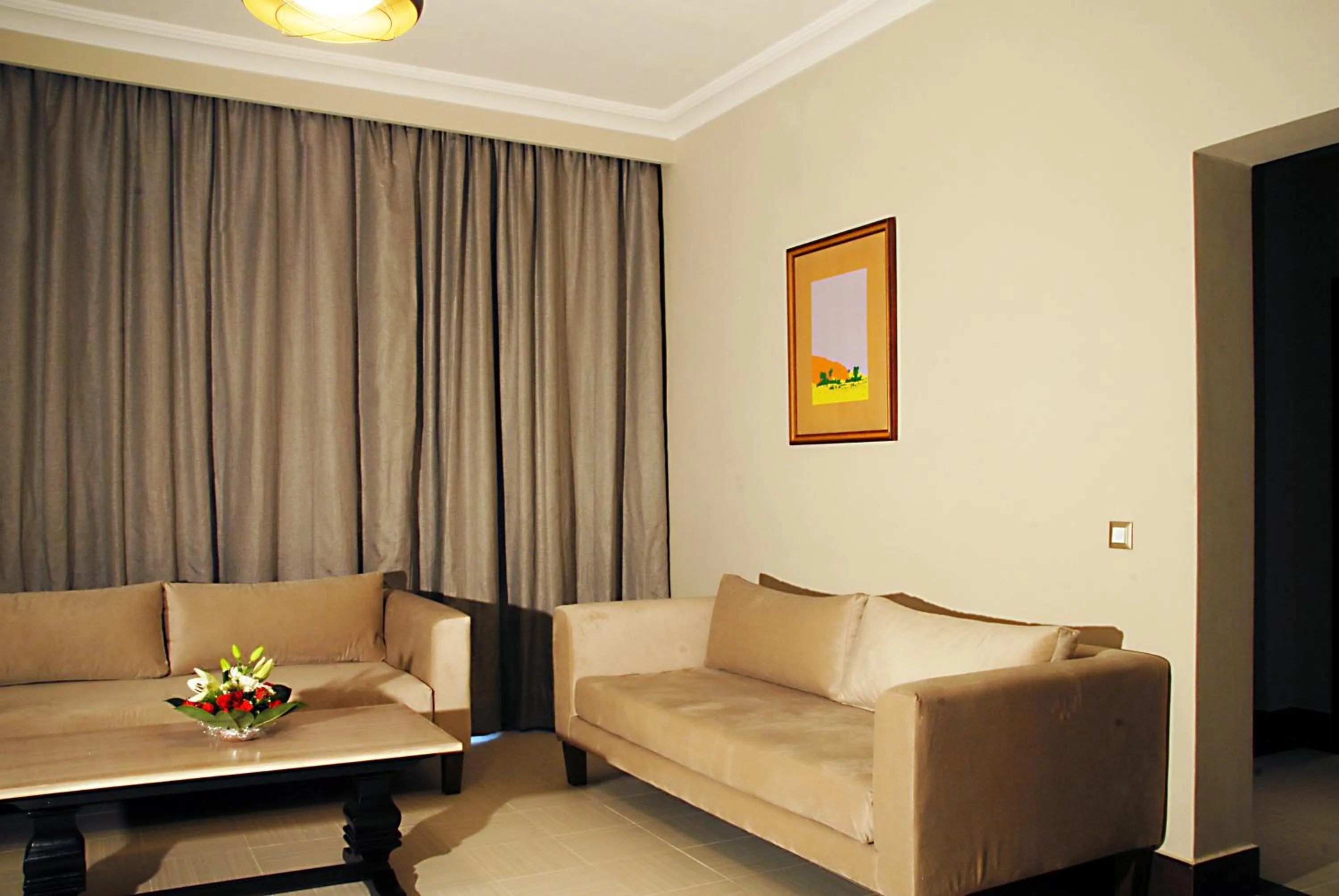 Living room in Oasis Palm Hotel