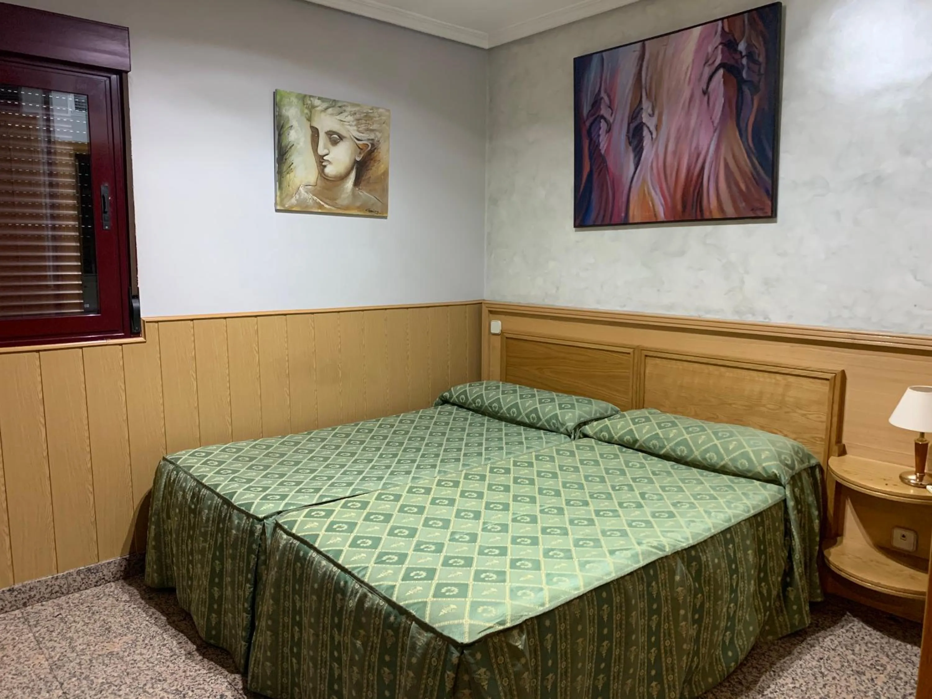 Bed in Hostal Juan XXIII