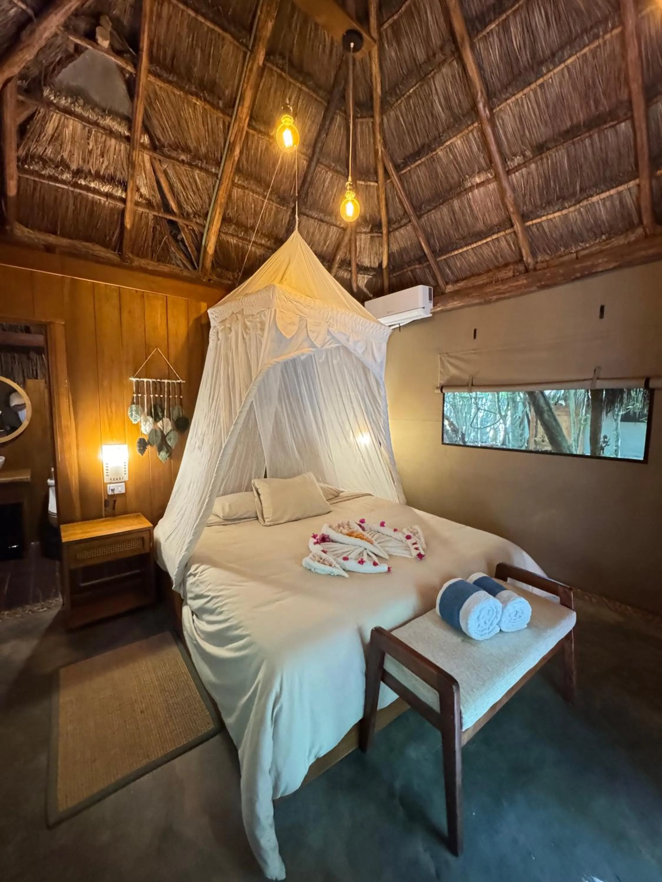 Bed in Akumal Natura Glamping