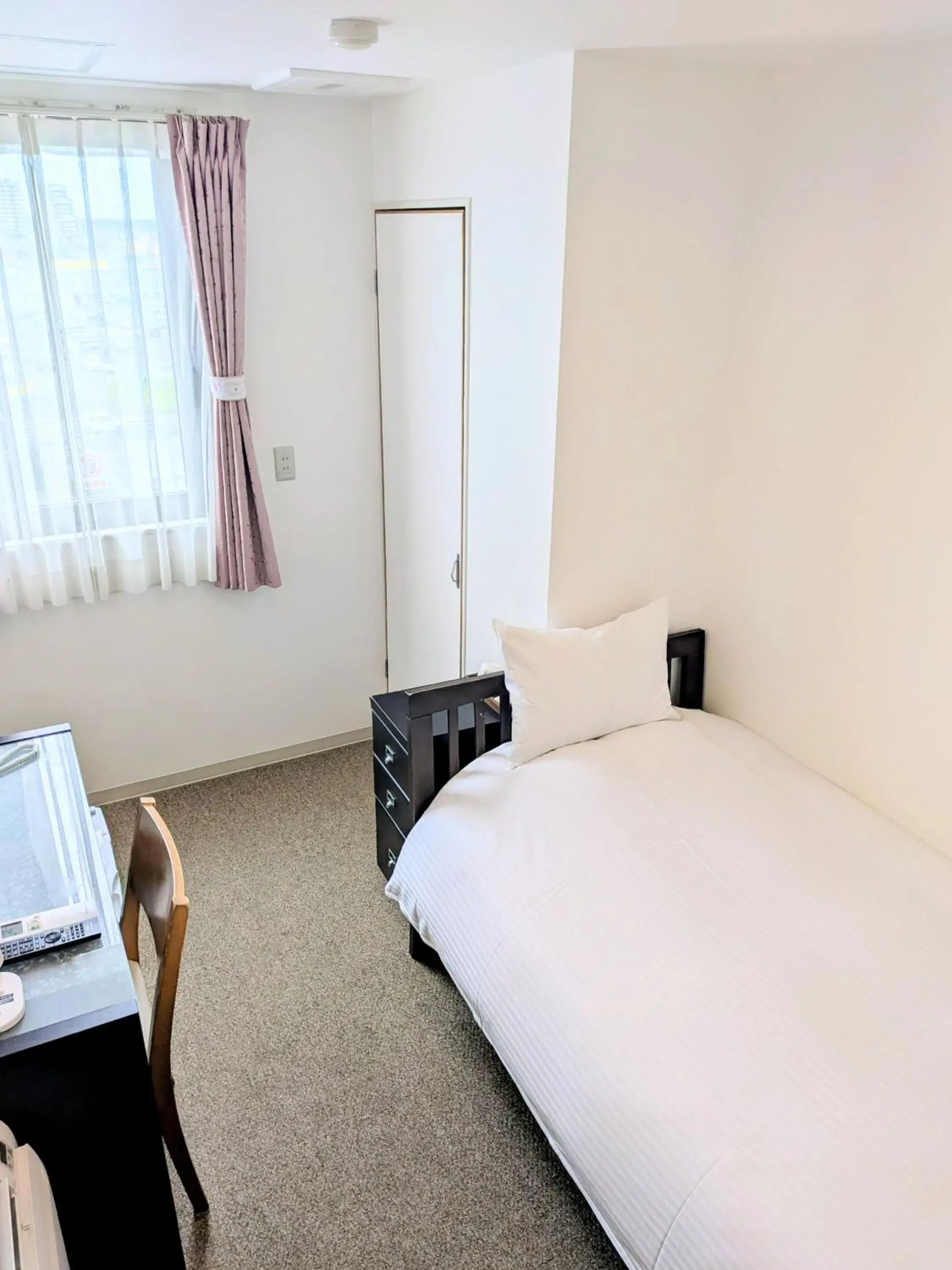 Bed in Sakura Hotel Oami Bed in Sakura Hotel Oami