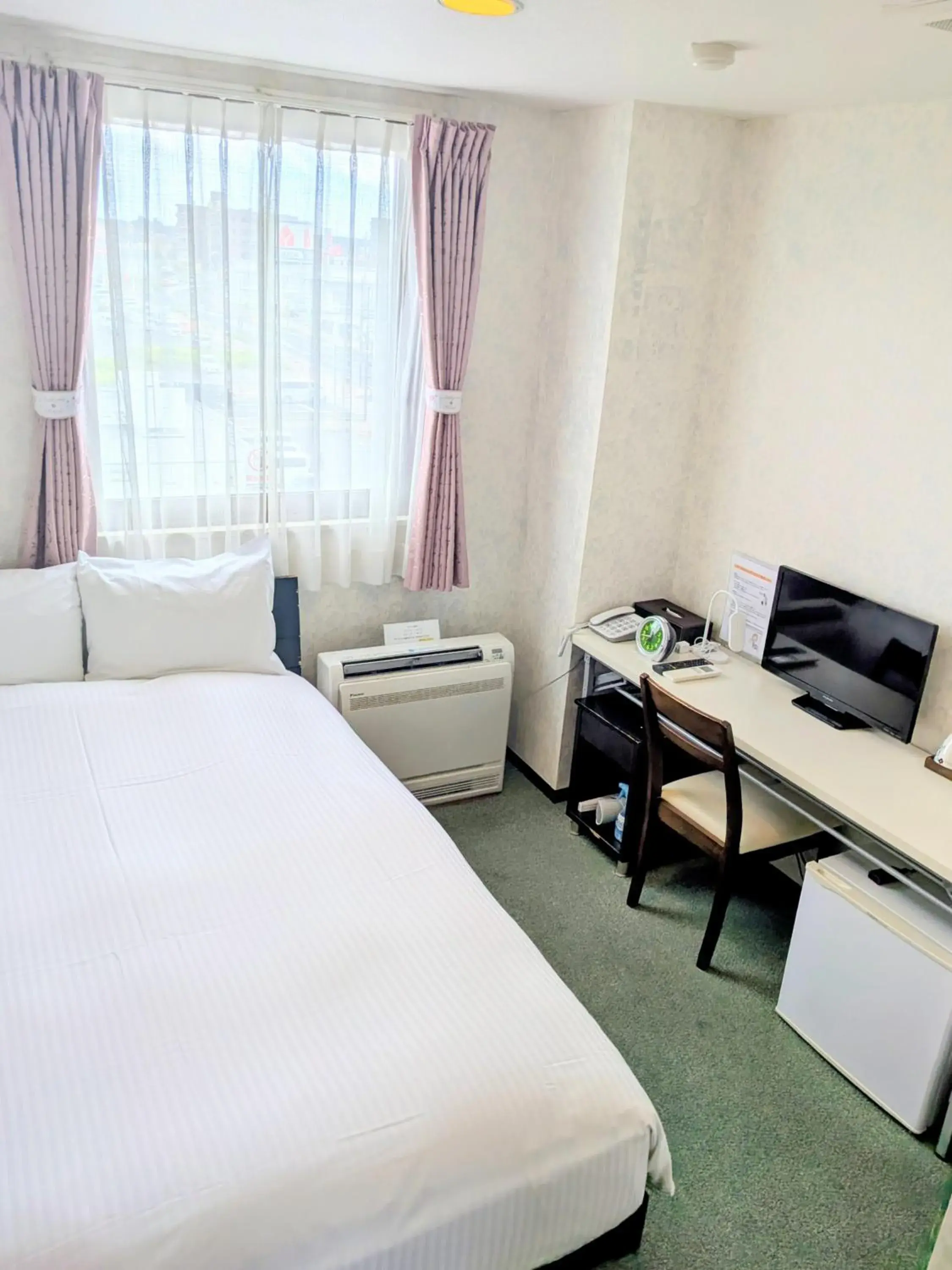 Bed in Sakura Hotel Oami Bed in Sakura Hotel Oami