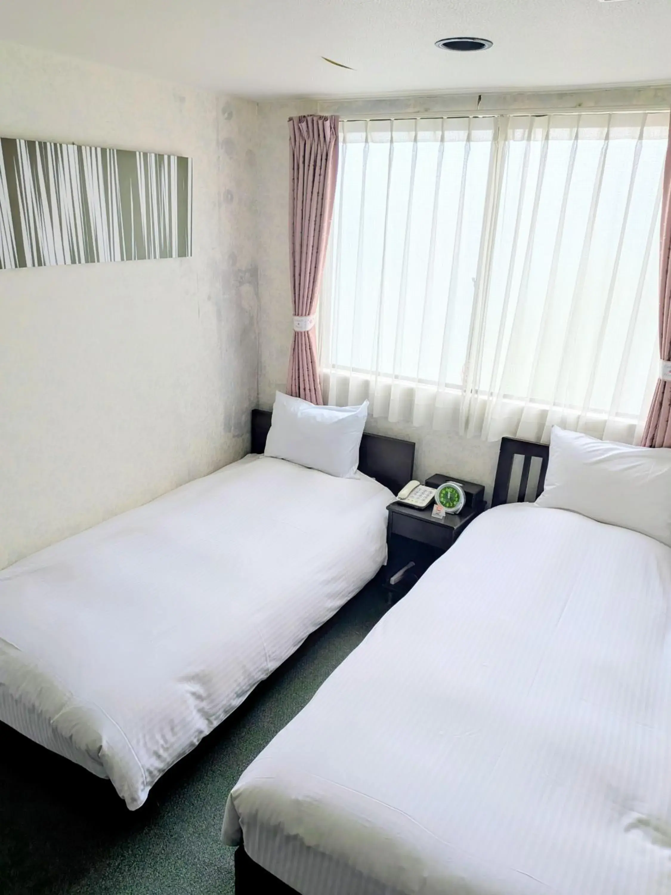 Bed in Sakura Hotel Oami Bed in Sakura Hotel Oami