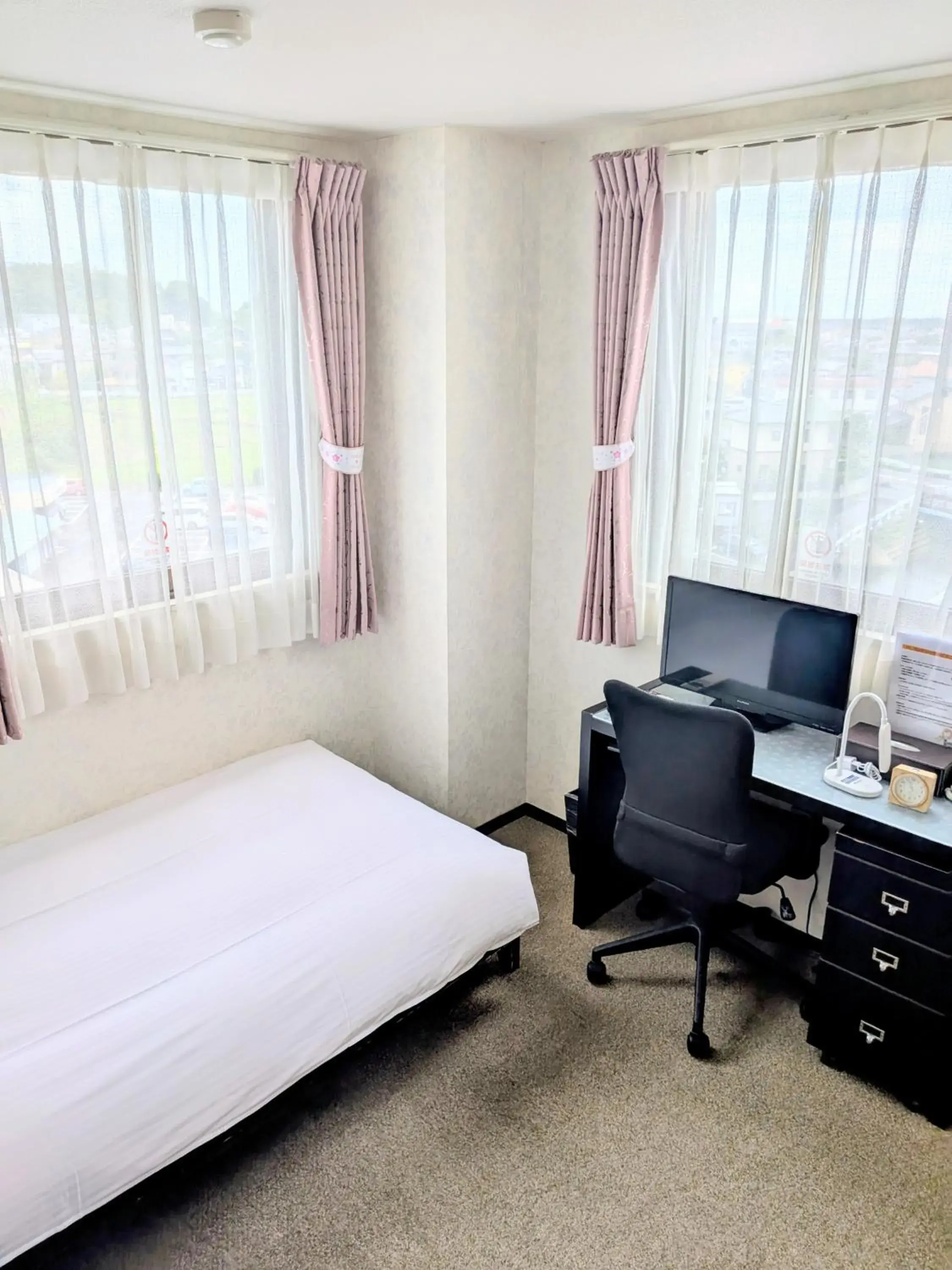 Bed in Sakura Hotel Oami Bed in Sakura Hotel Oami