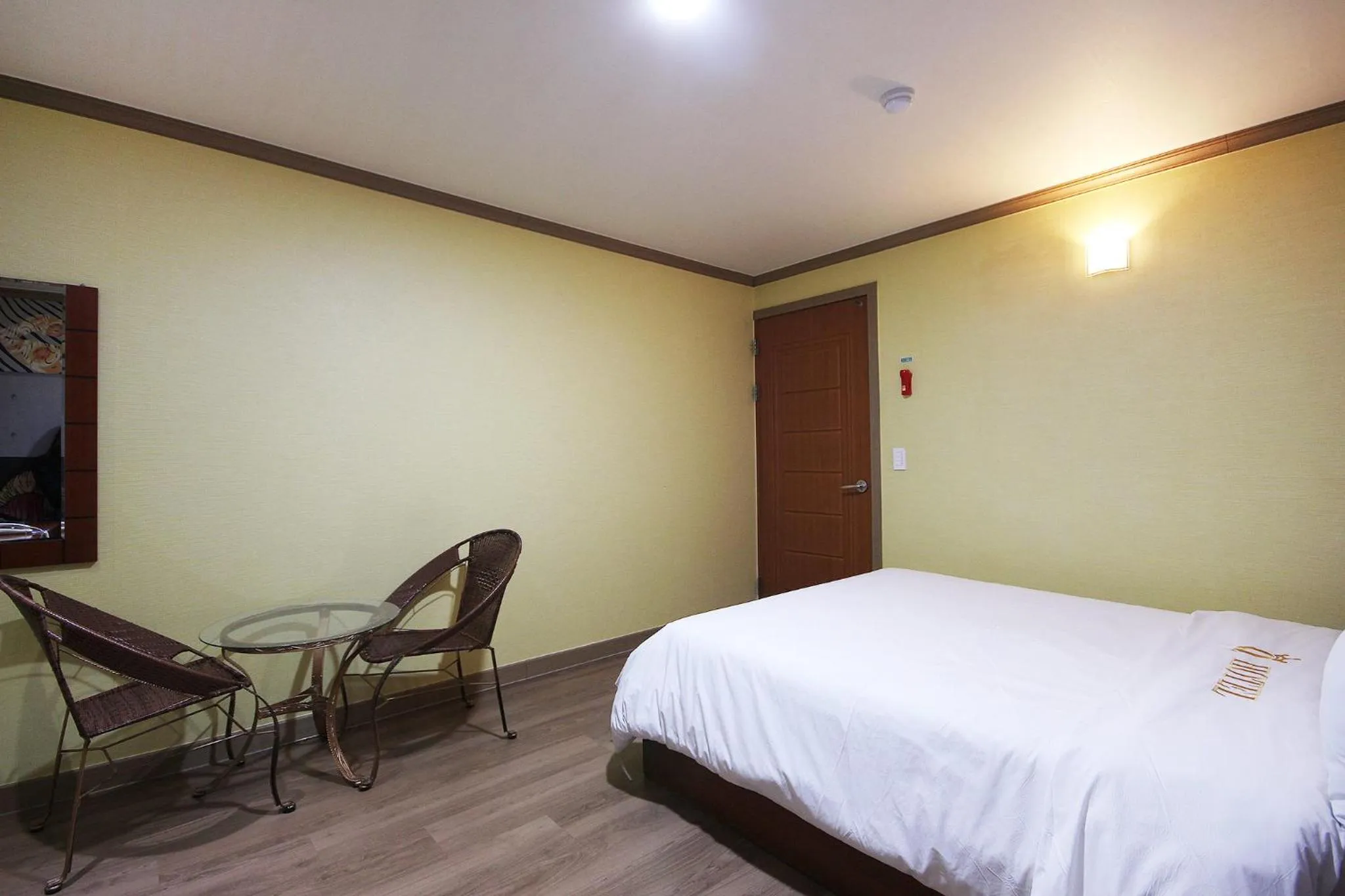 Bed in Happy Q Motel