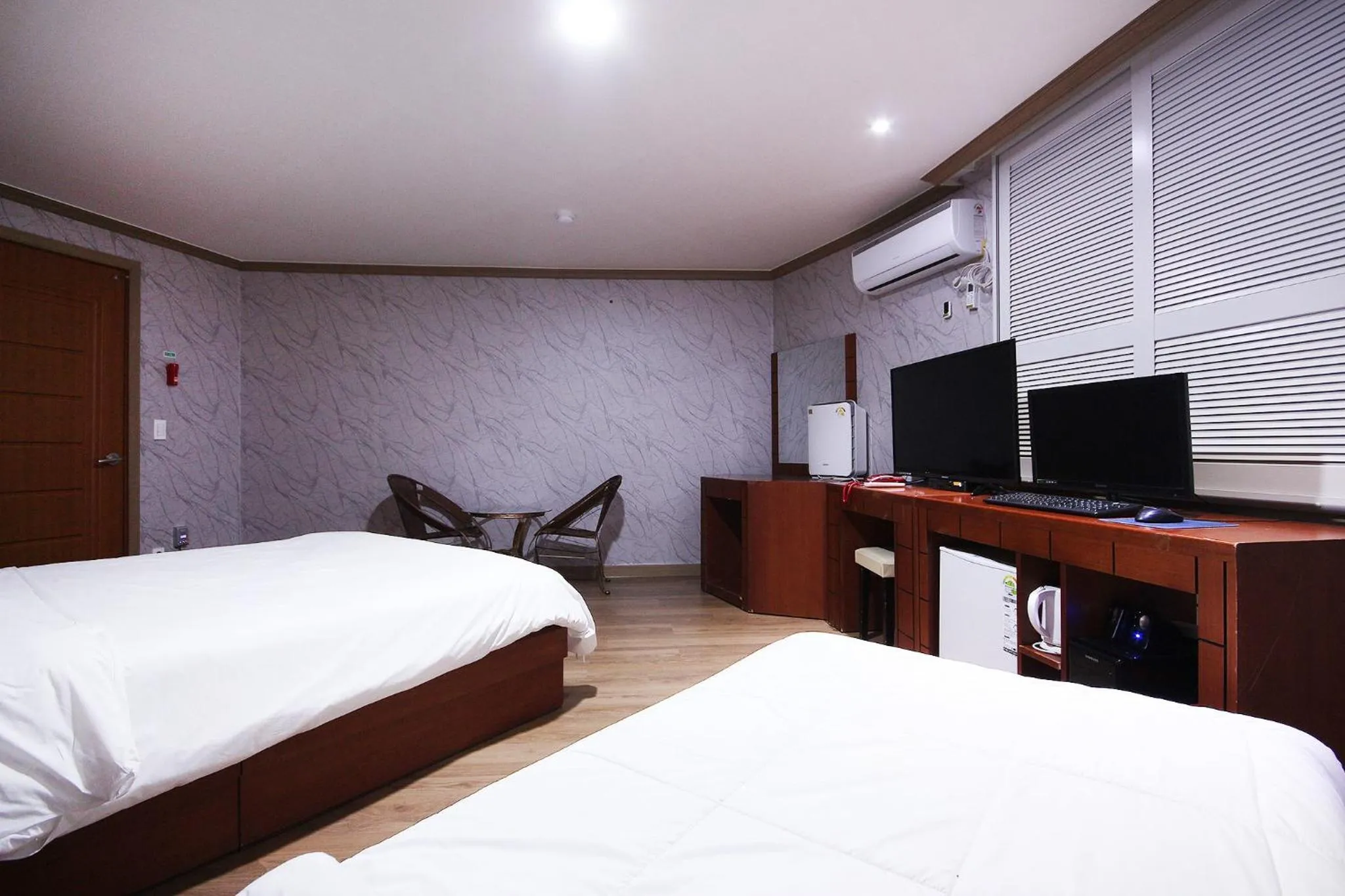 Bed in Happy Q Motel