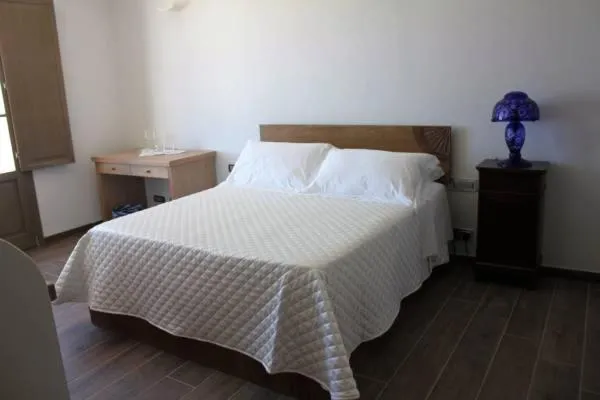 Bed in Serra Niedda Resort & Agriturismo