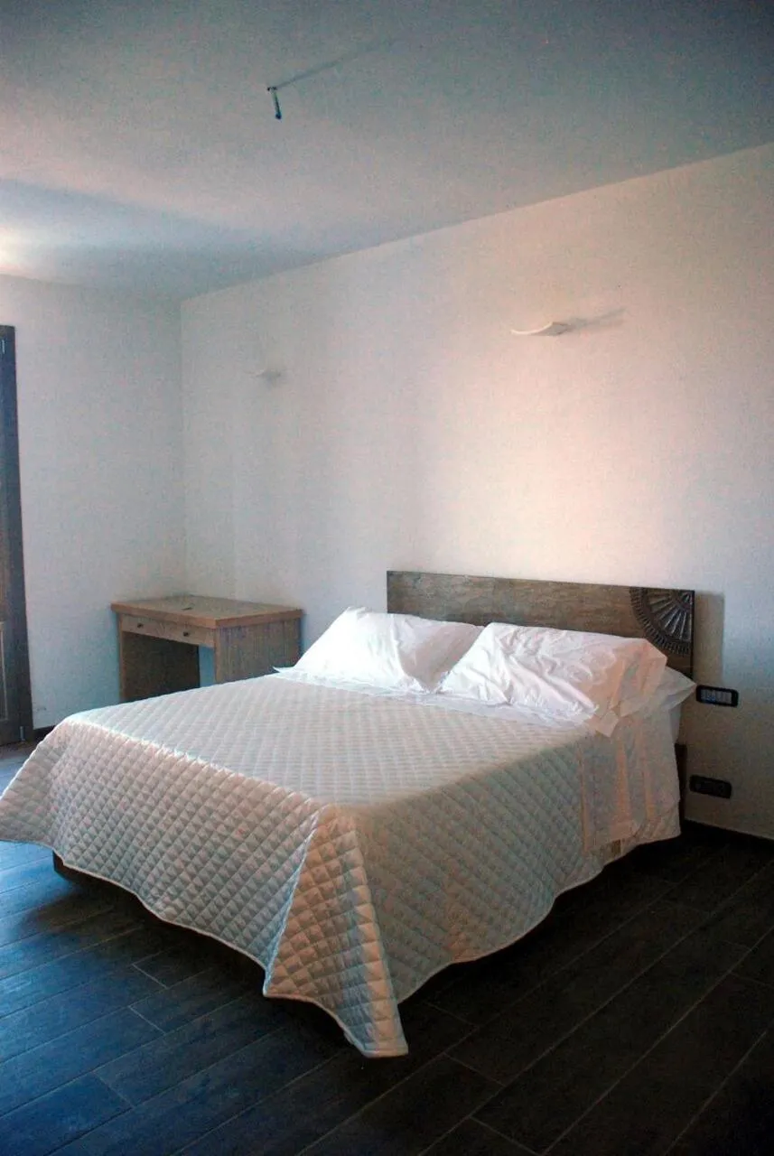 Bed in Serra Niedda Resort & Agriturismo