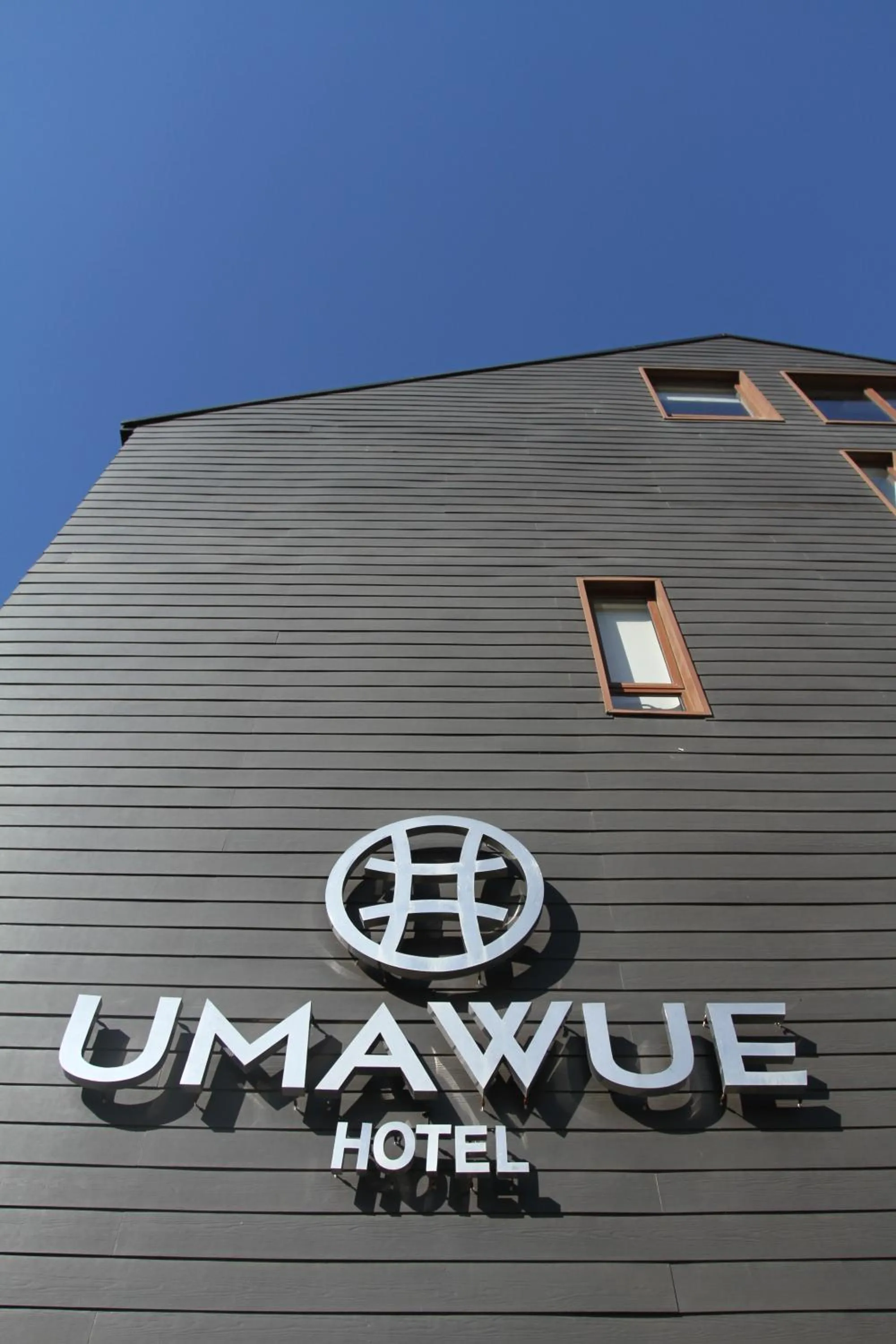 Property logo or sign in Hotel Umawue