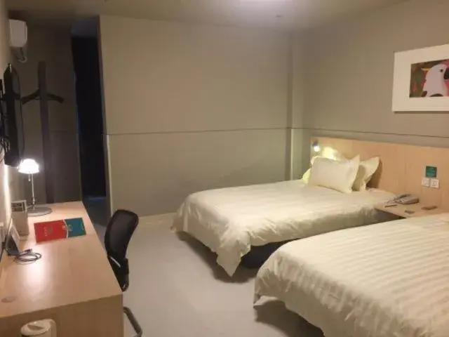 Bed in Magnolia Hotel Cangzhou West Railway Station Jiefang Road Bed in Magnolia Hotel Cangzhou West Railway Station Jiefang Road