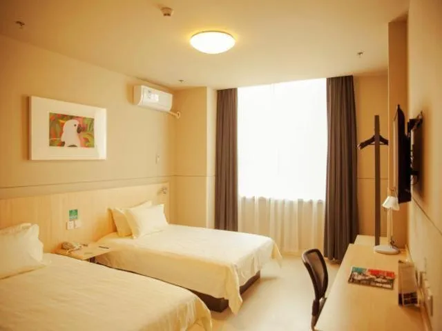 Bed in Magnolia Hotel Cangzhou West Railway Station Jiefang Road