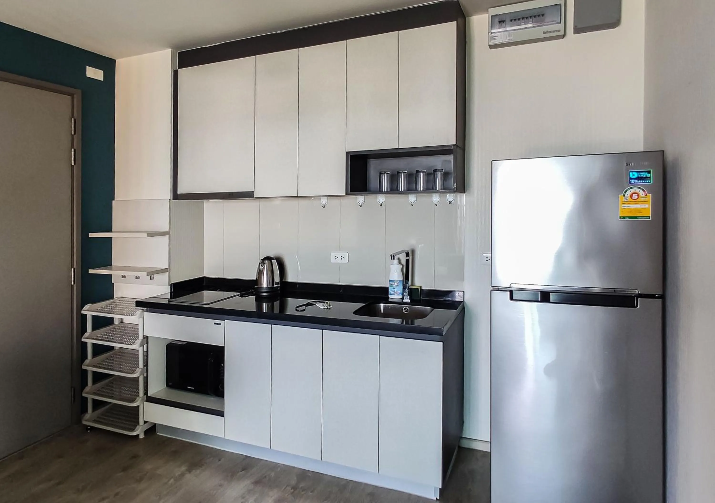 kitchen in Many Holiday The Base Condo