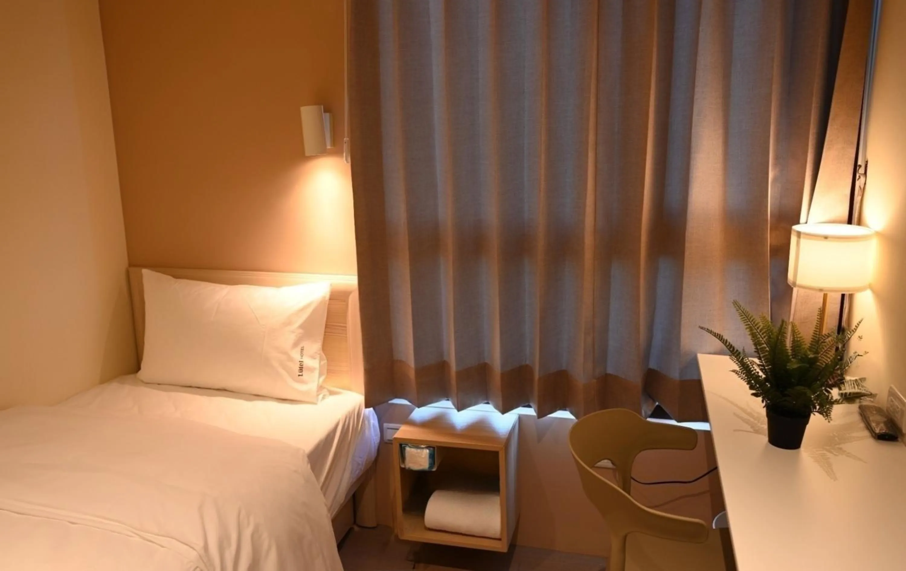 Photo of the whole room, Bed in Lütel Hotel Xpark Gloria Outlets Shin Kong Cinemas