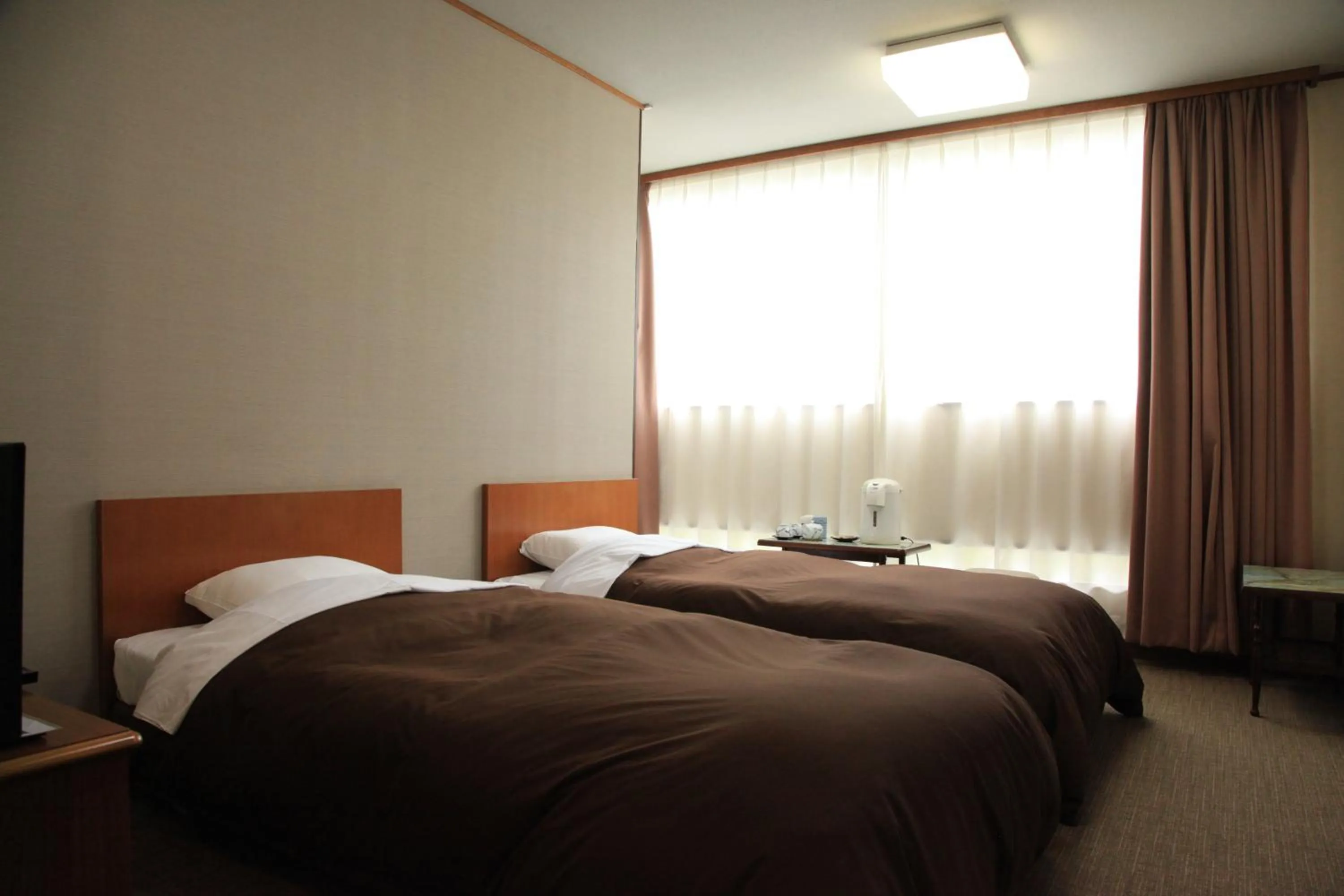 Photo of the whole room, Bed in Hotel New Kotobuki