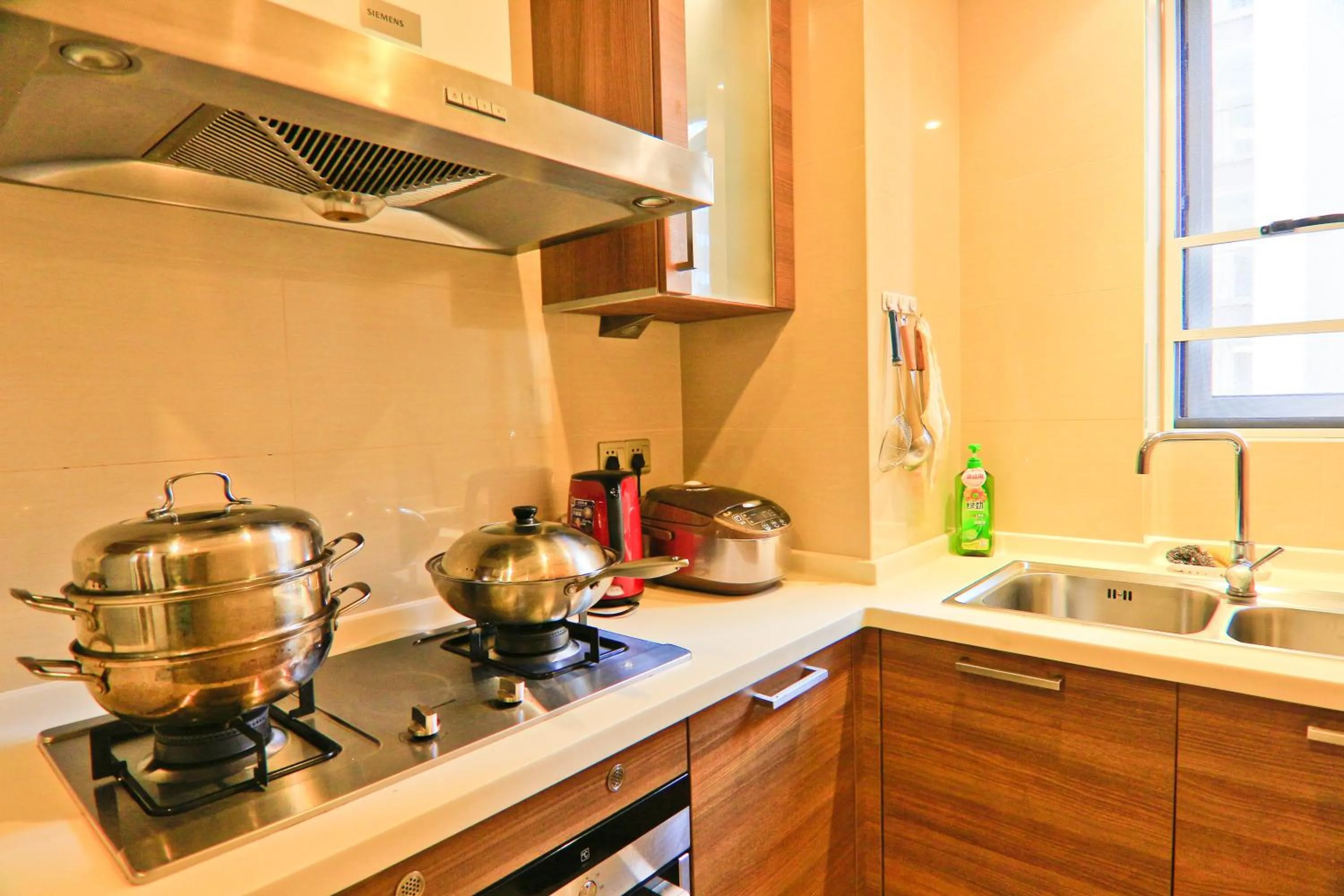 Kitchen or kitchenette in Sanya Yikehai View Apartments