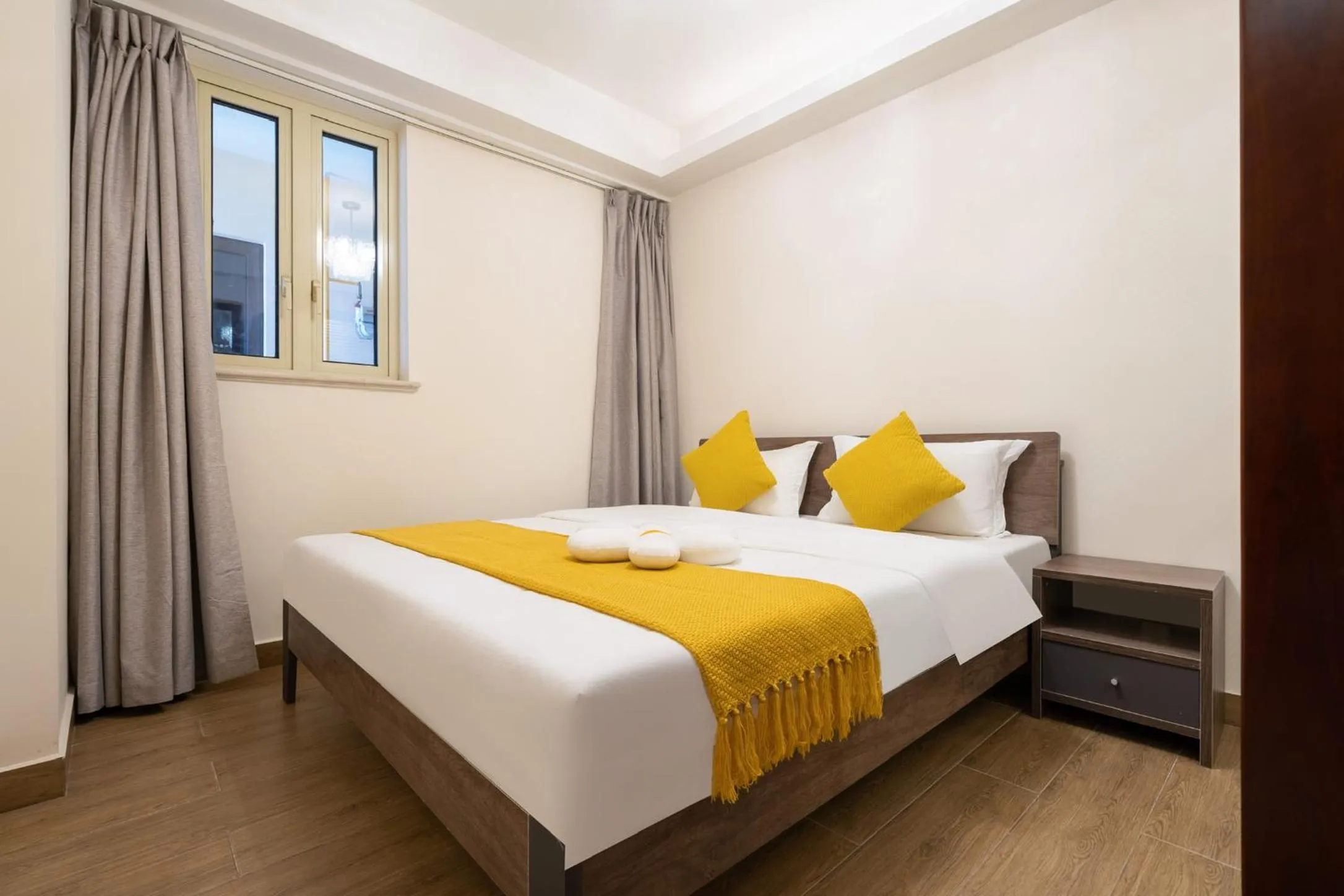 Bed in Sanya Yikehai View Apartments