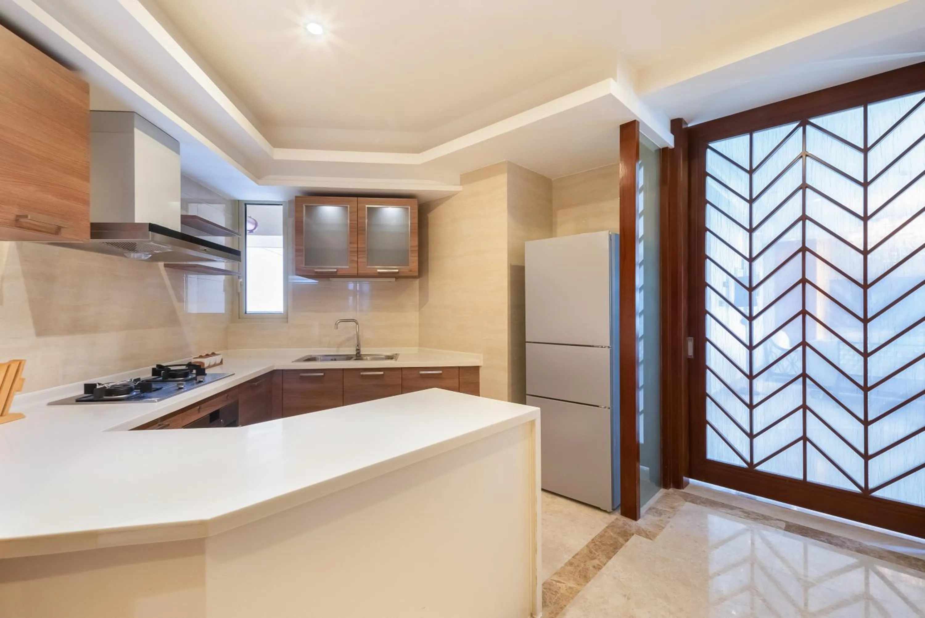 Kitchen or kitchenette in Sanya Yikehai View Apartments