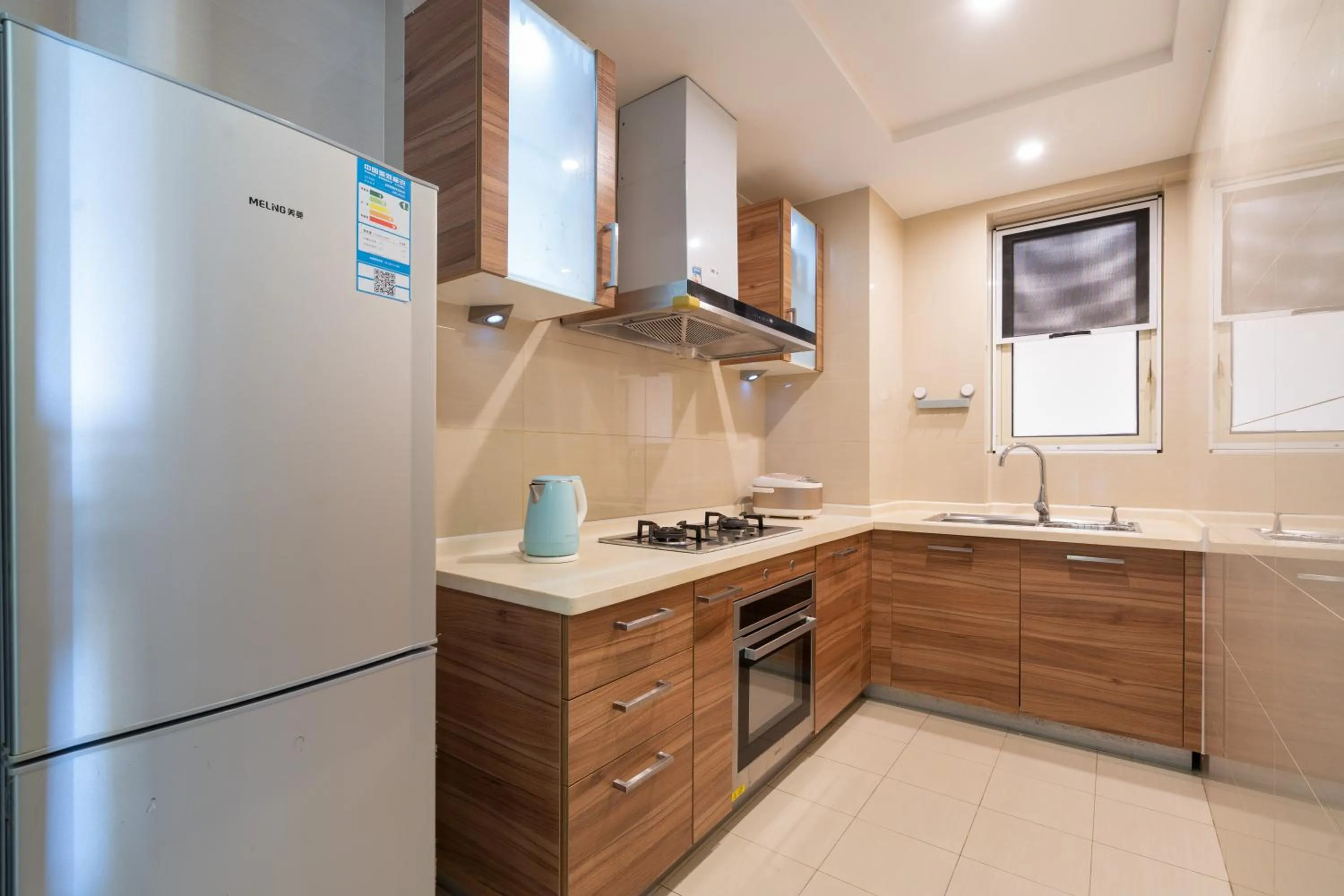Kitchen or kitchenette in Sanya Yikehai View Apartments