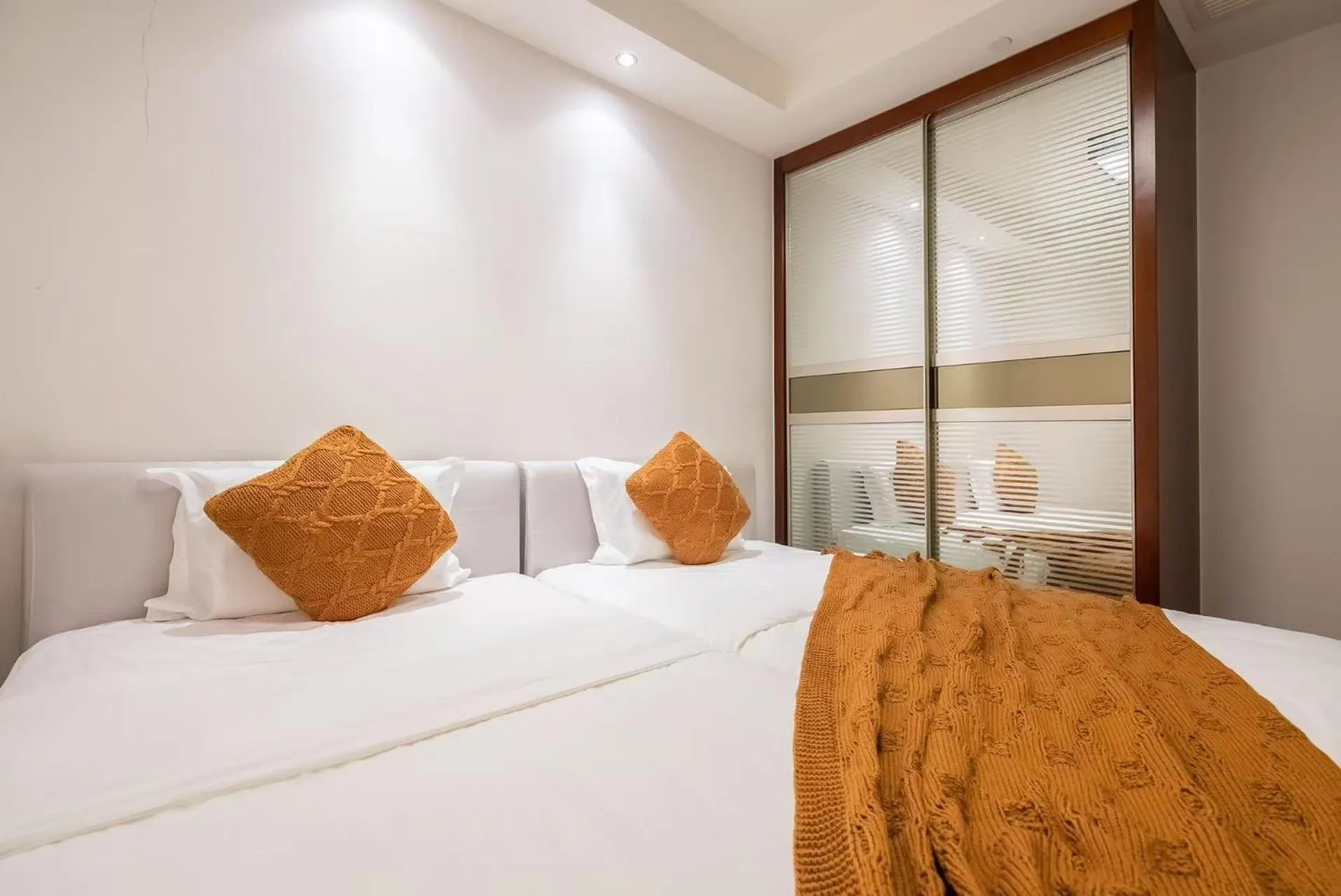 Bed in Sanya Yikehai View Apartments