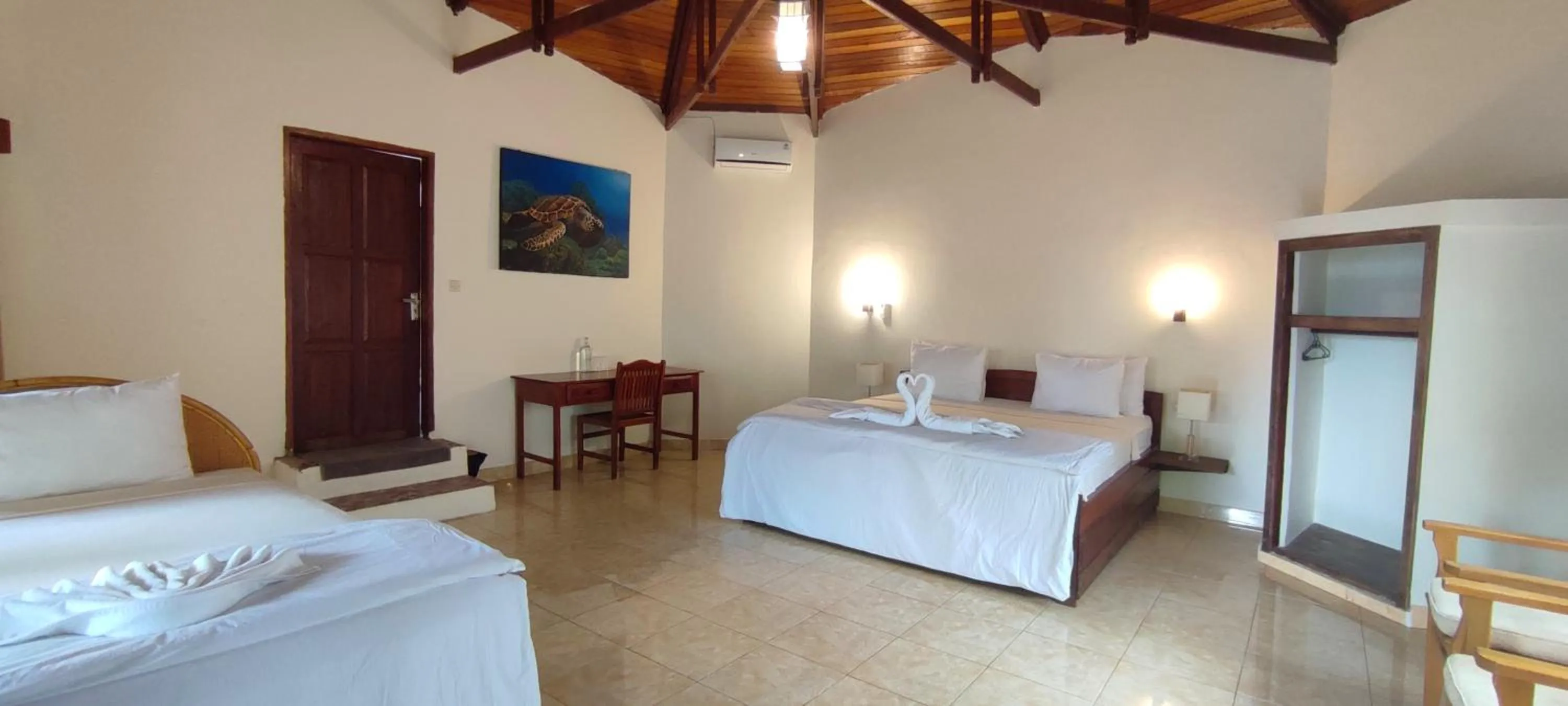 Bathroom, Bed in Bara Beach Bungalows