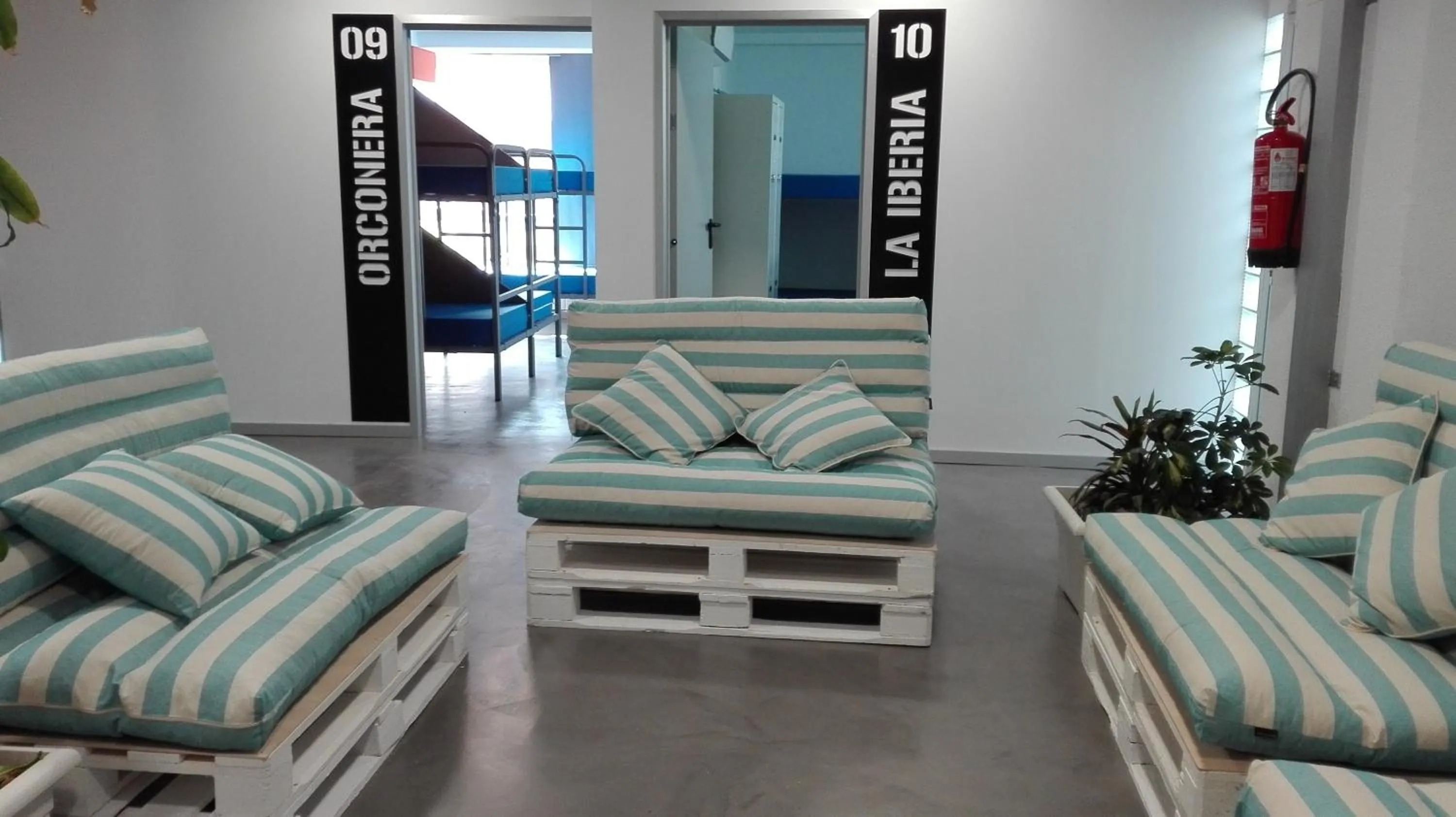 Communal lounge/ TV room in All Iron Hostel