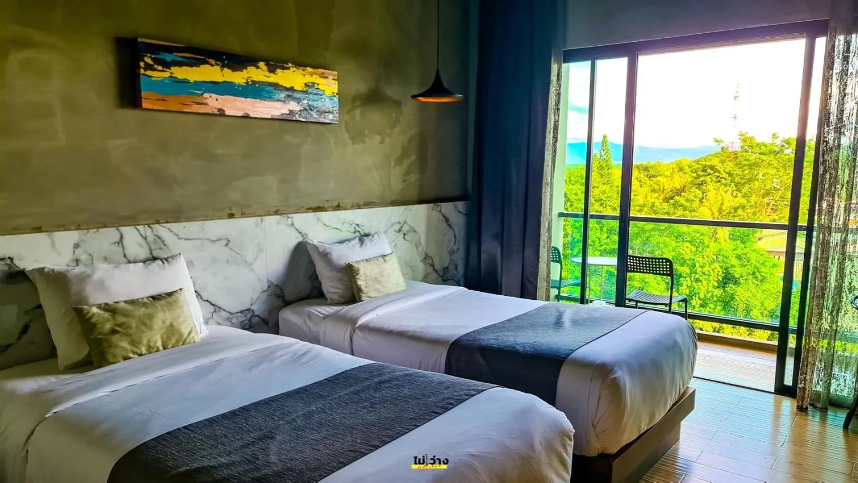 Bed in Chiangkhong Teak Garden Riverfront Onsen Hotel- SHA Extra Plus