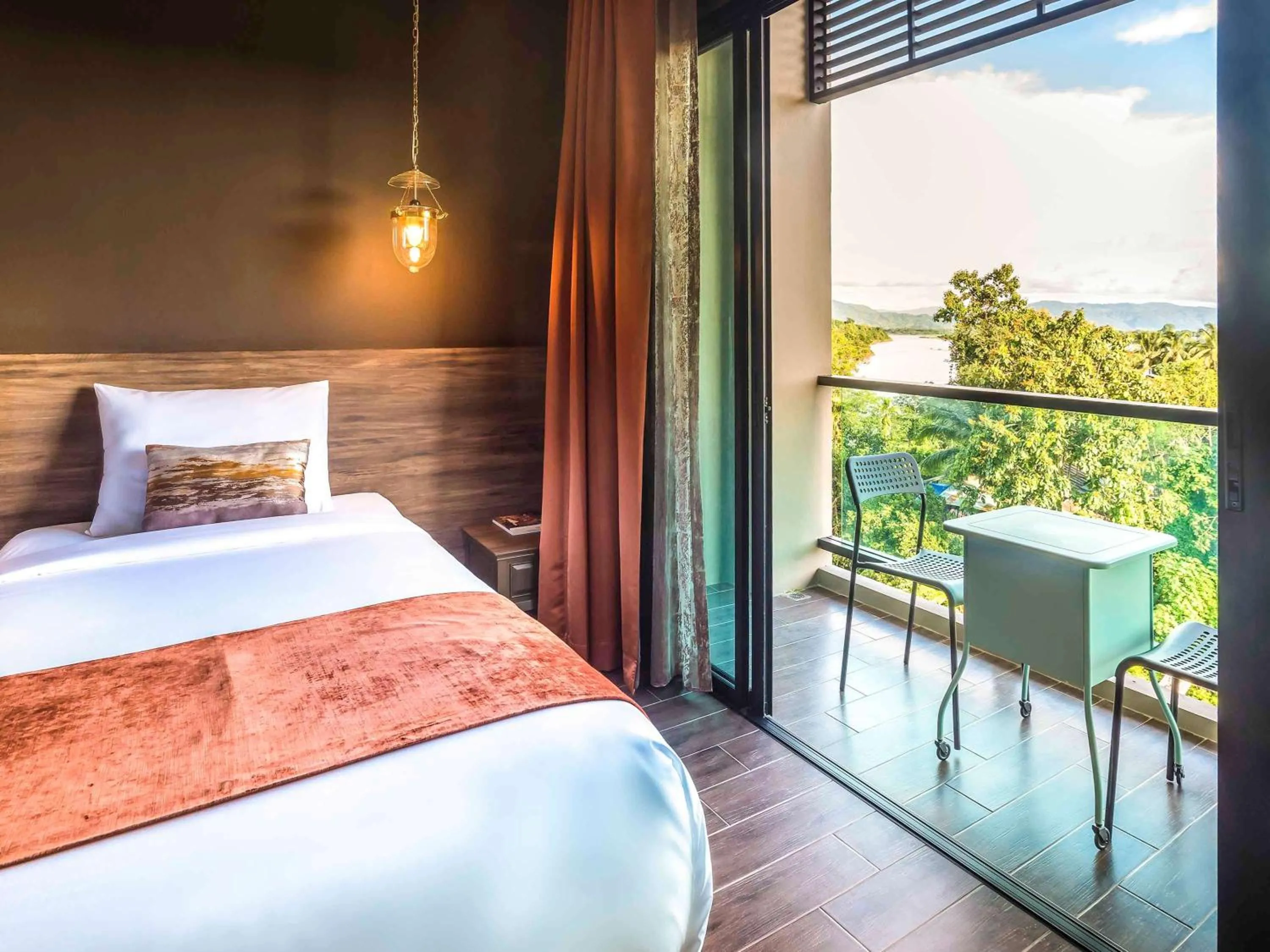 Photo of the whole room, Bed in Chiangkhong Teak Garden Riverfront Onsen Hotel- SHA Extra Plus