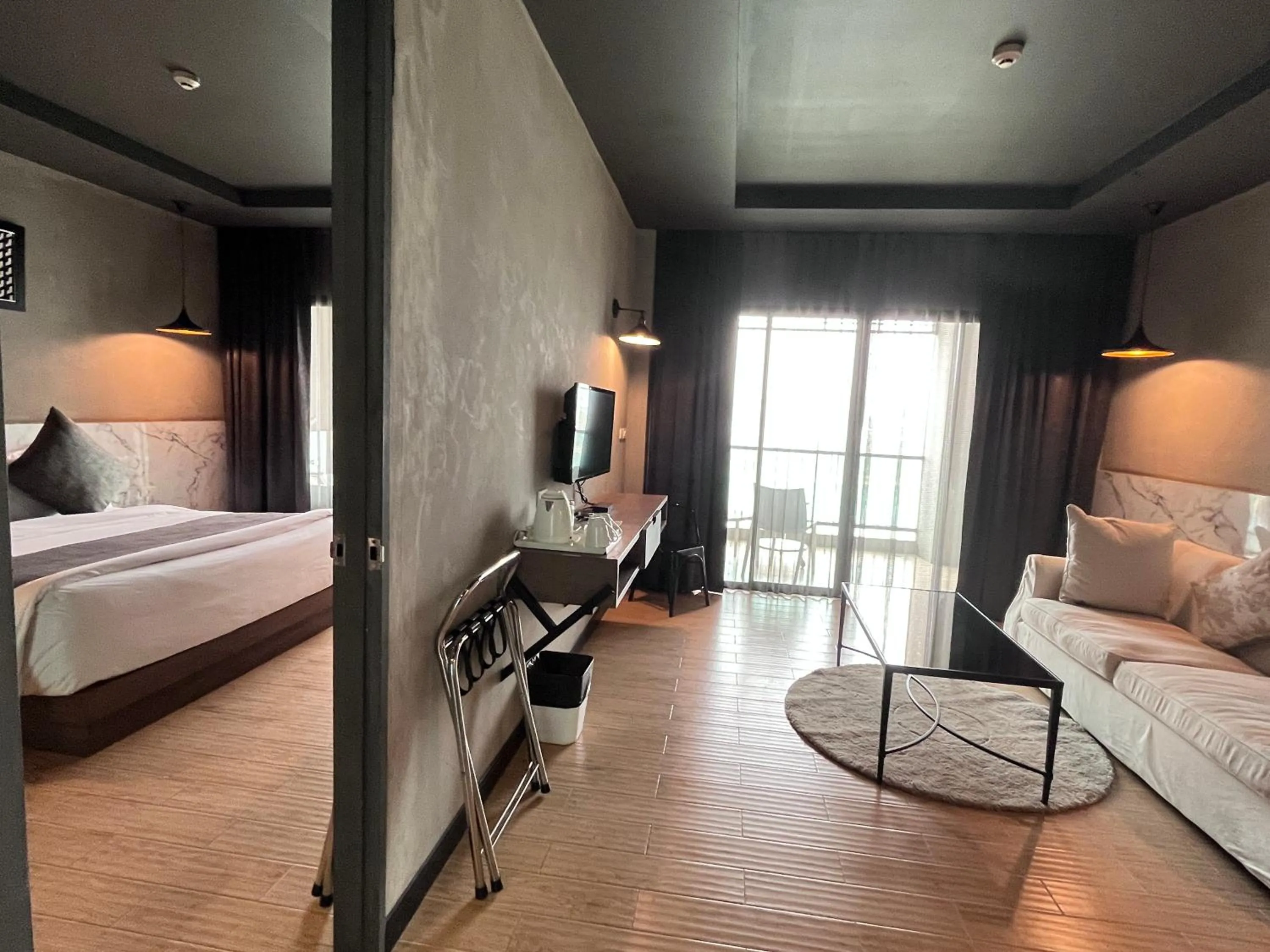 Bed in Chiangkhong Teak Garden Riverfront Onsen Hotel- SHA Extra Plus