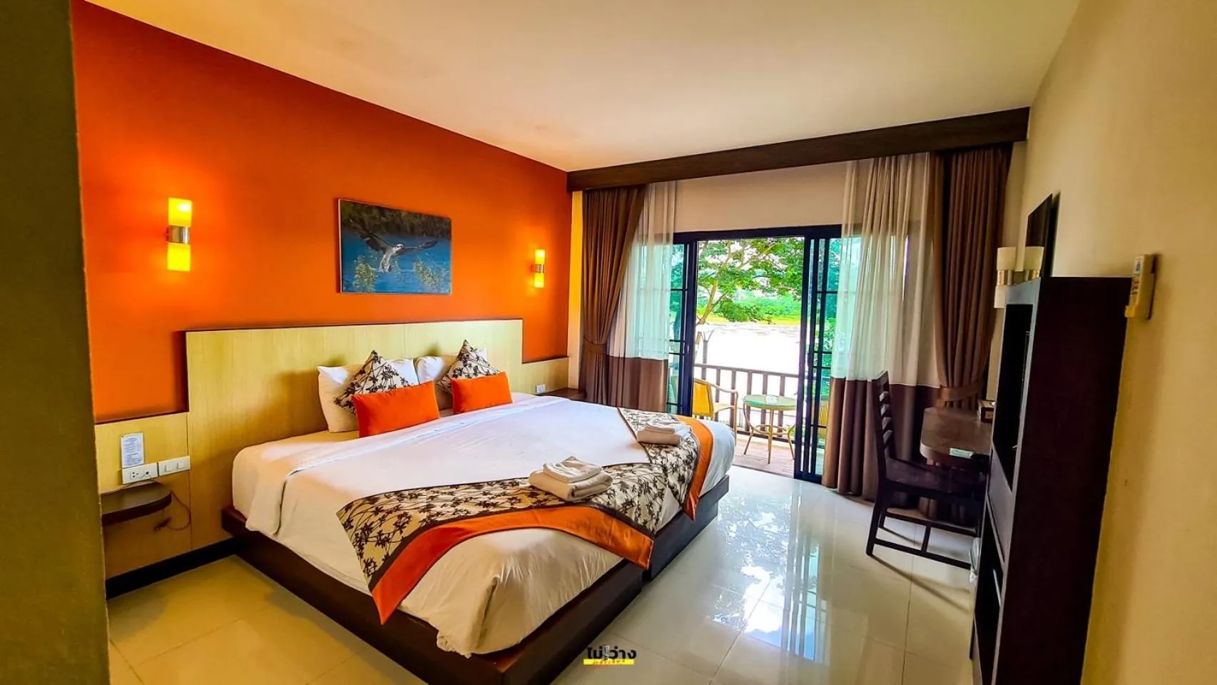 Bed in Chiangkhong Teak Garden Riverfront Onsen Hotel- SHA Extra Plus