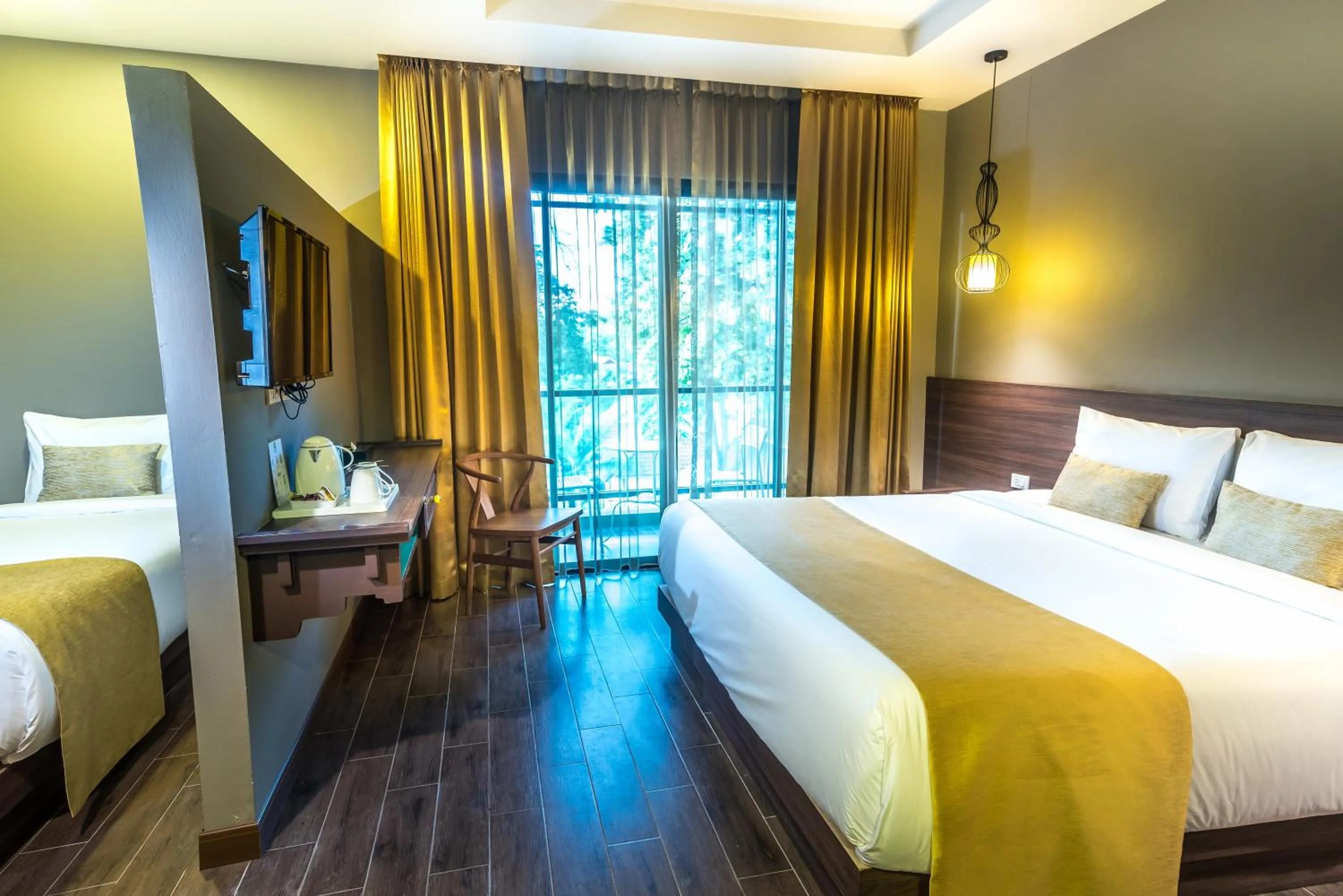 Bed in Chiangkhong Teak Garden Riverfront Onsen Hotel- SHA Extra Plus