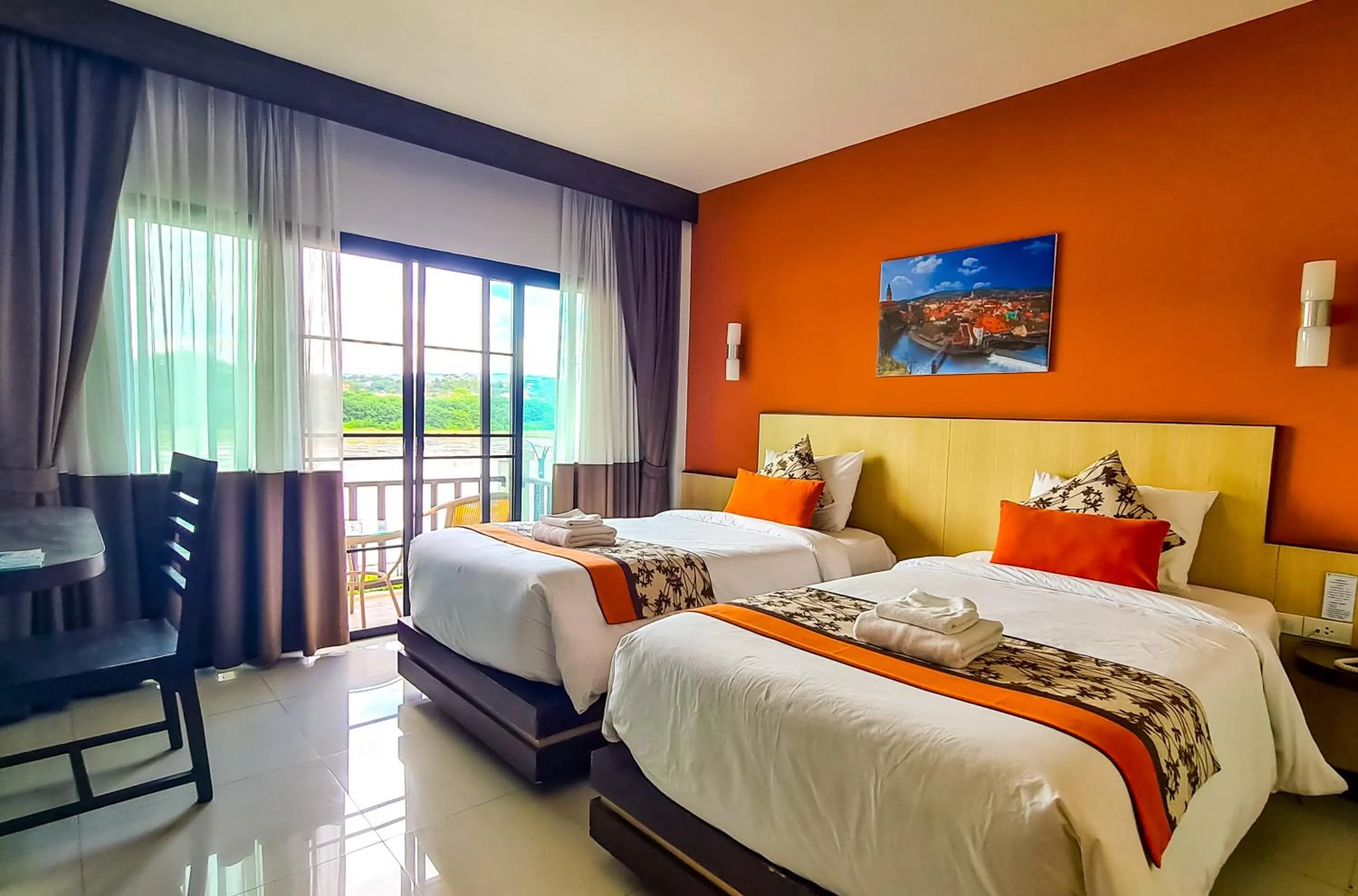 Bed in Chiangkhong Teak Garden Riverfront Onsen Hotel- SHA Extra Plus