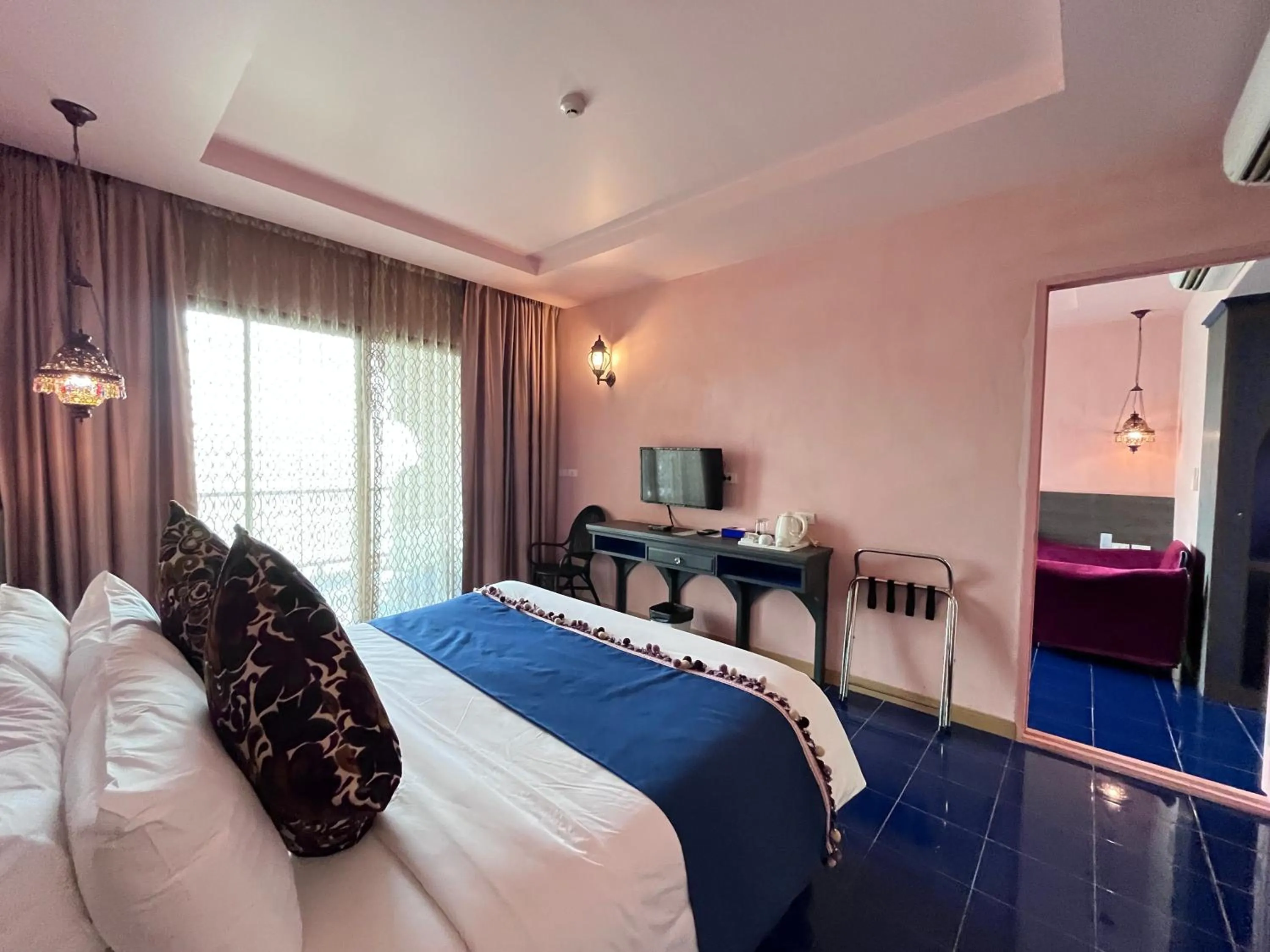 Bed in Chiangkhong Teak Garden Riverfront Onsen Hotel- SHA Extra Plus