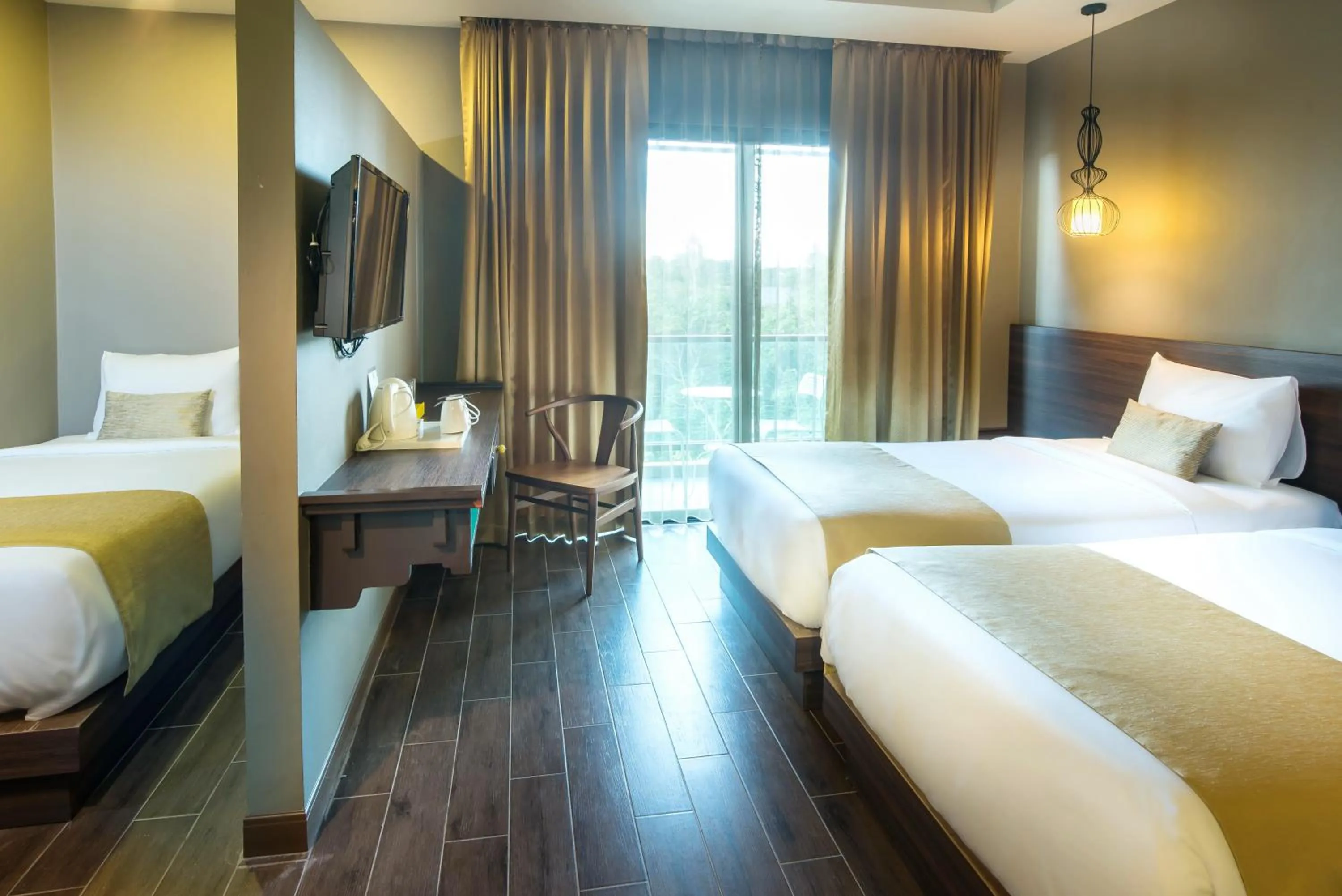 Bed in Chiangkhong Teak Garden Riverfront Onsen Hotel- SHA Extra Plus