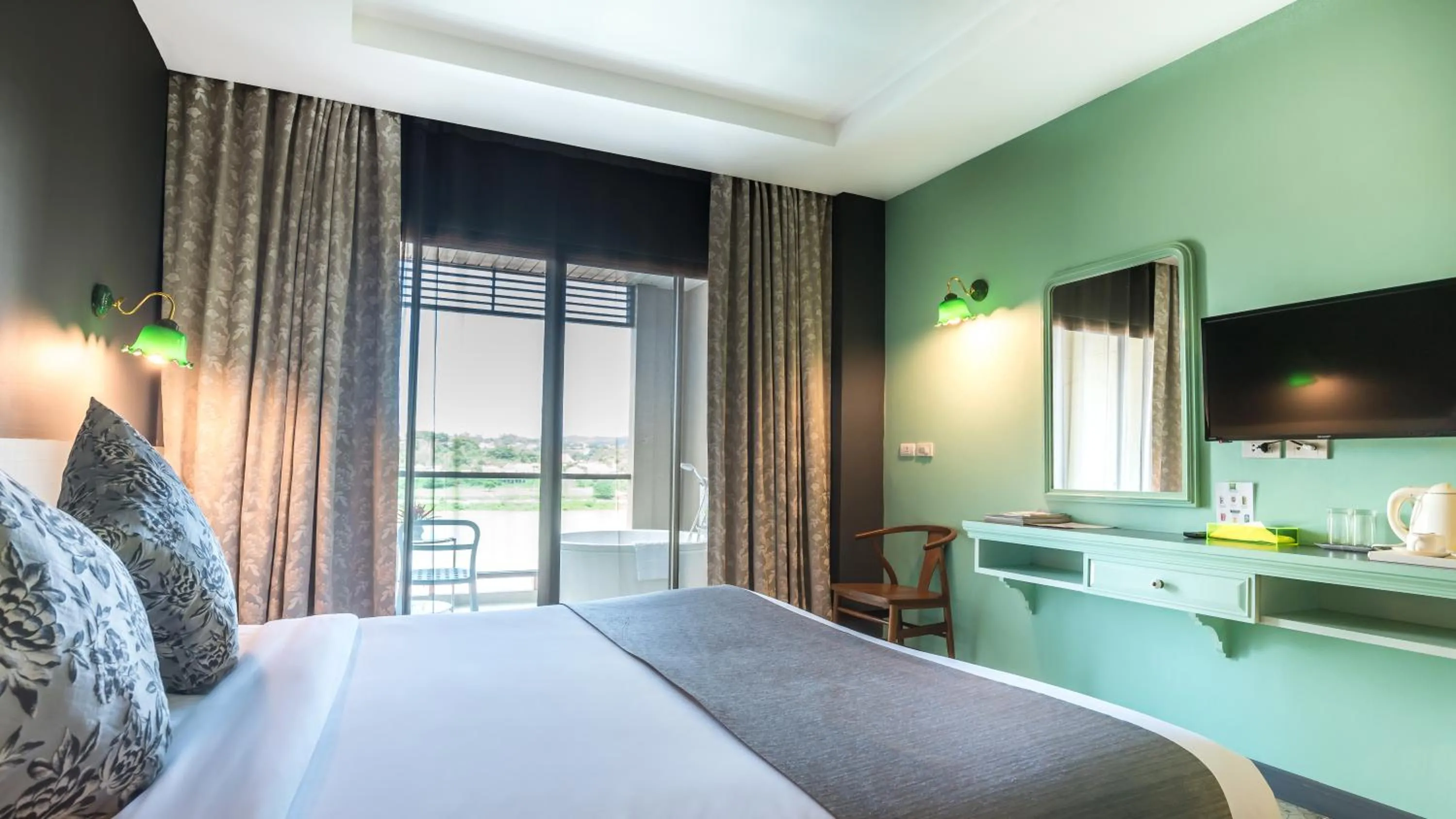 Photo of the whole room, Bed in Chiangkhong Teak Garden Riverfront Onsen Hotel- SHA Extra Plus