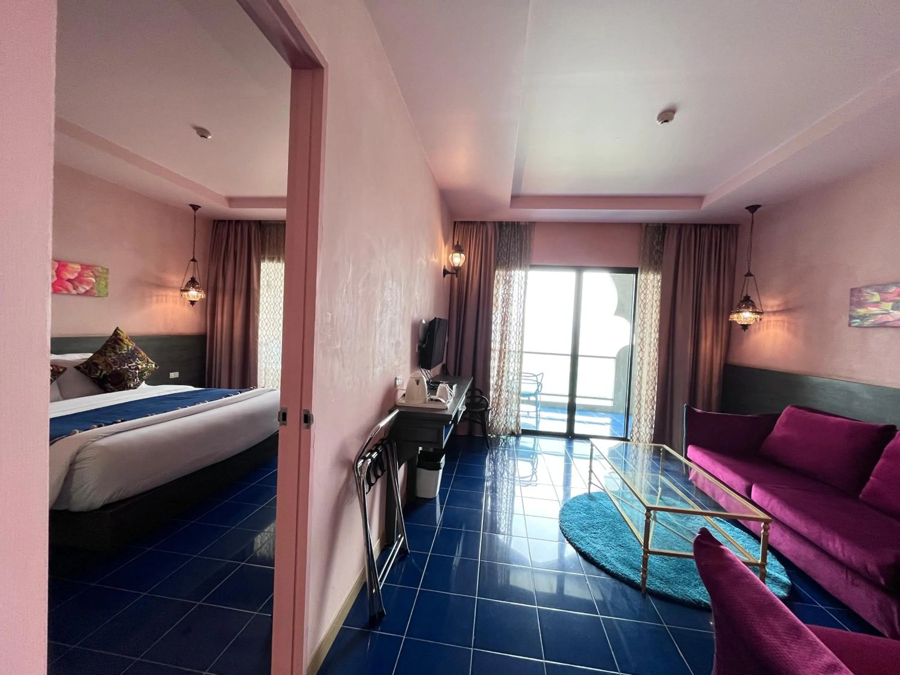 Bed in Chiangkhong Teak Garden Riverfront Onsen Hotel- SHA Extra Plus