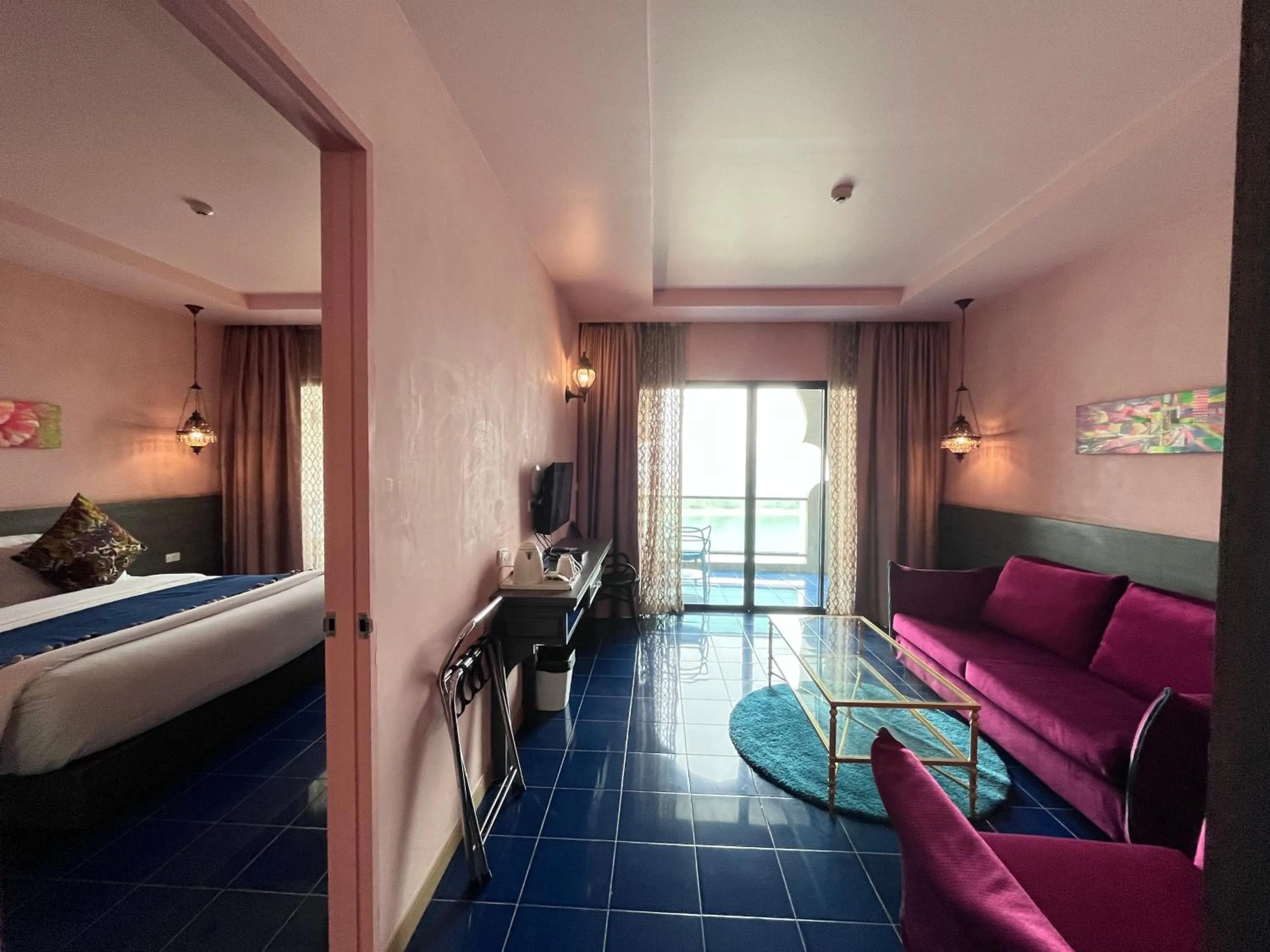 Bed in Chiangkhong Teak Garden Riverfront Onsen Hotel- SHA Extra Plus