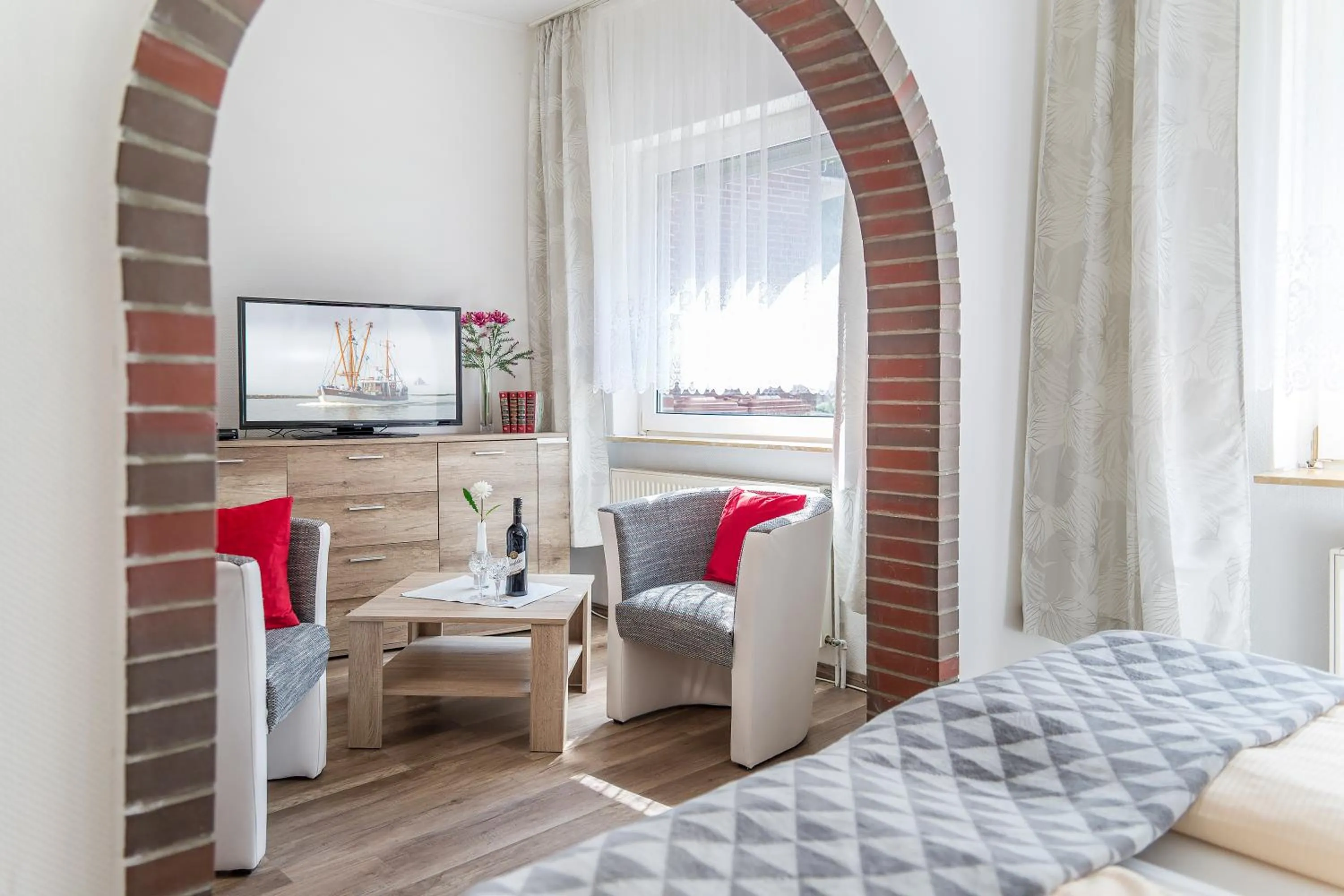 Living room, Bed in Hotel Garni Kröger