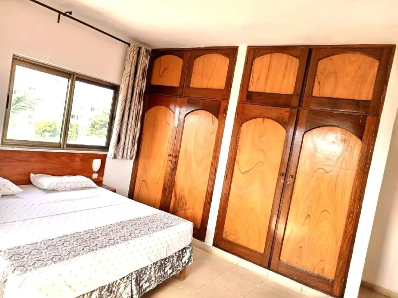 Bed in Rosalie's Suites