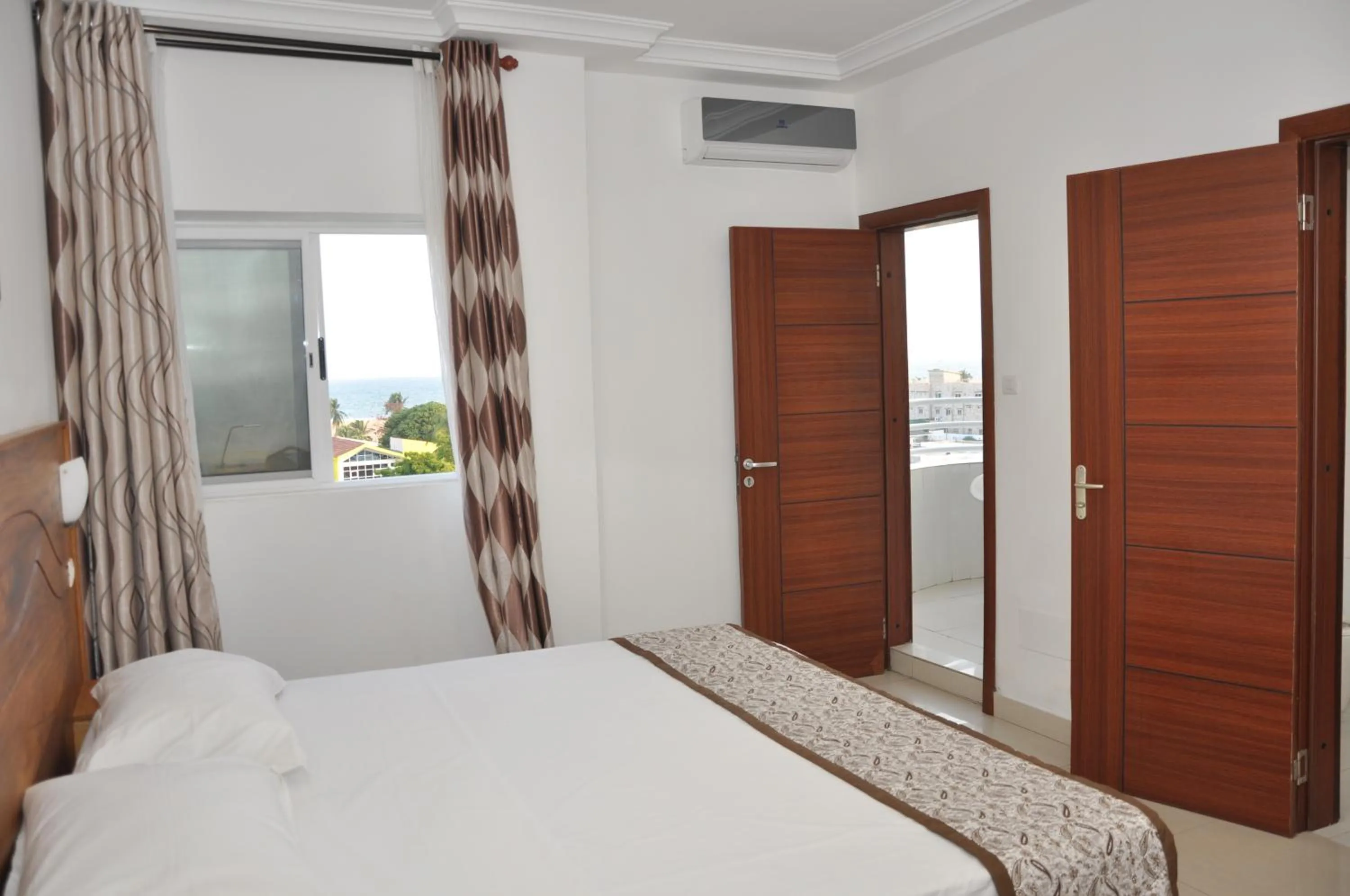 Bed in Rosalie's Suites