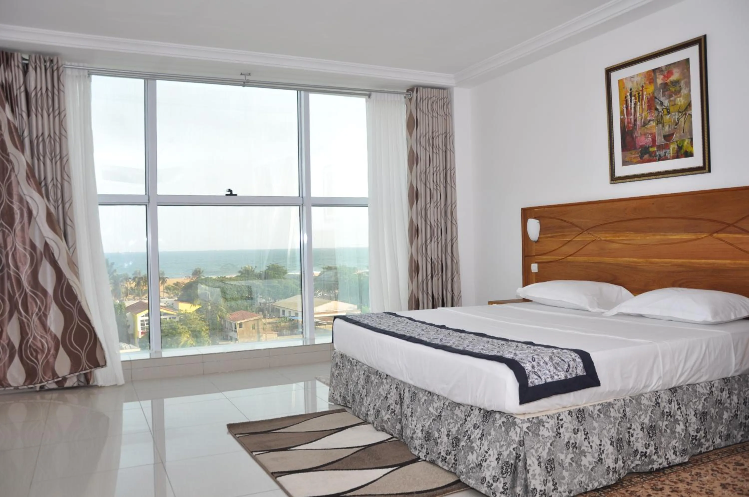 Bed in Rosalie's Suites