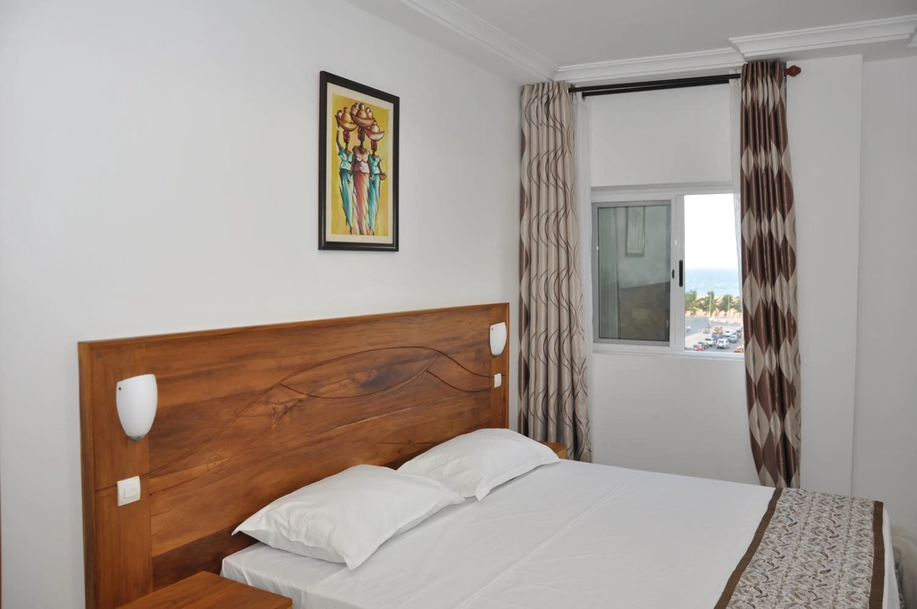 Bed in Rosalie's Suites