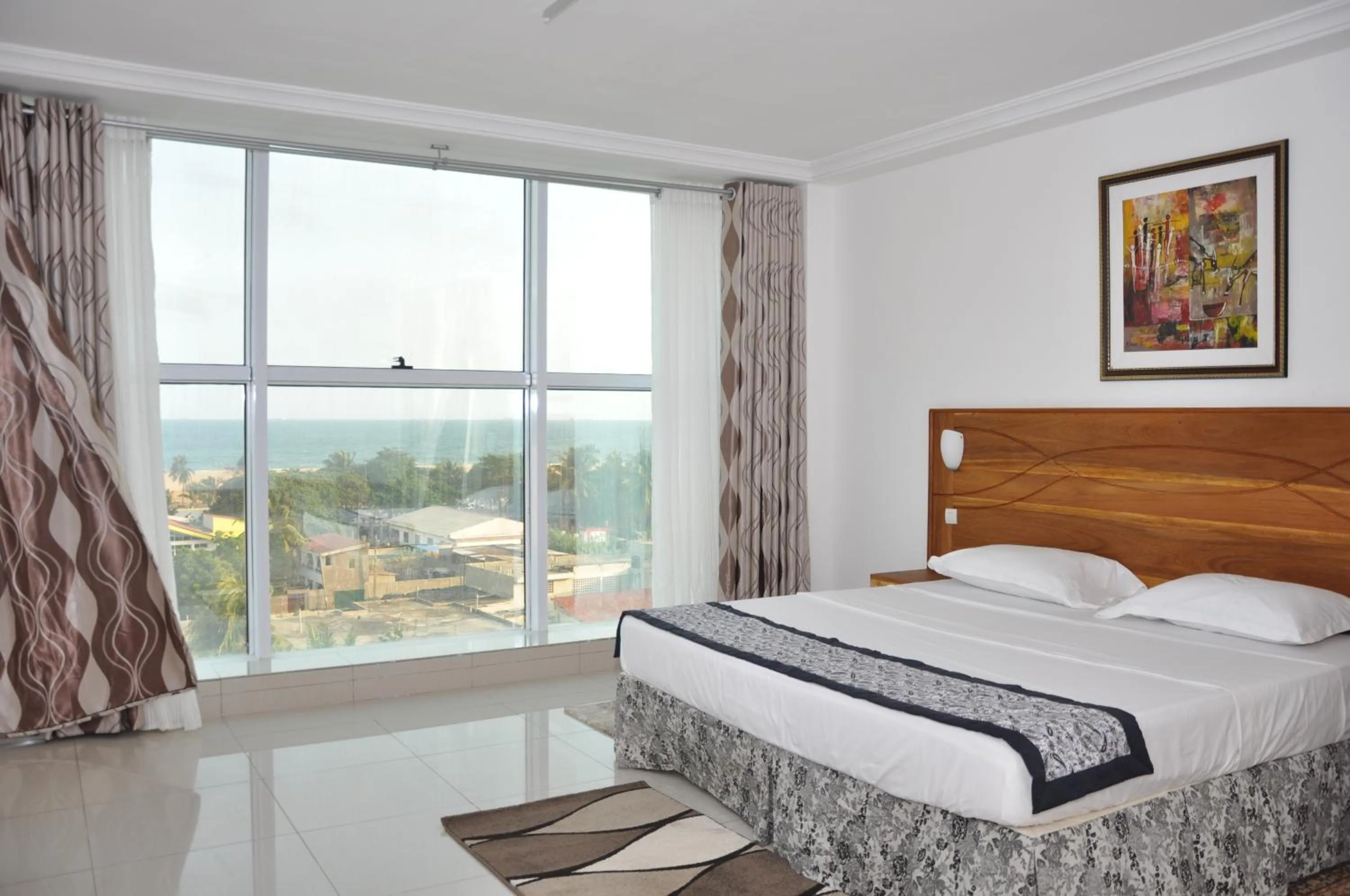 Bed in Rosalie's Suites