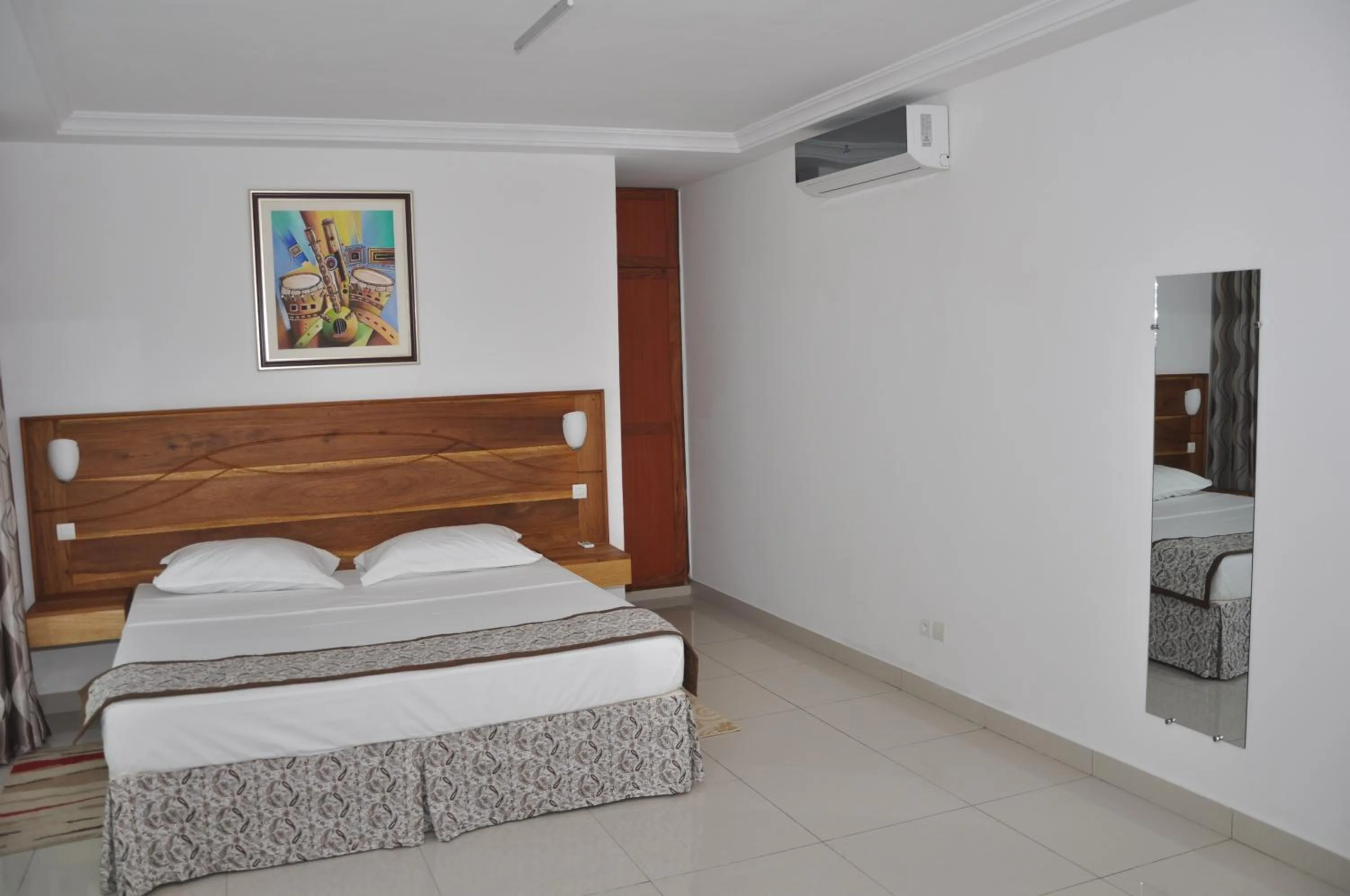 Bed in Rosalie's Suites