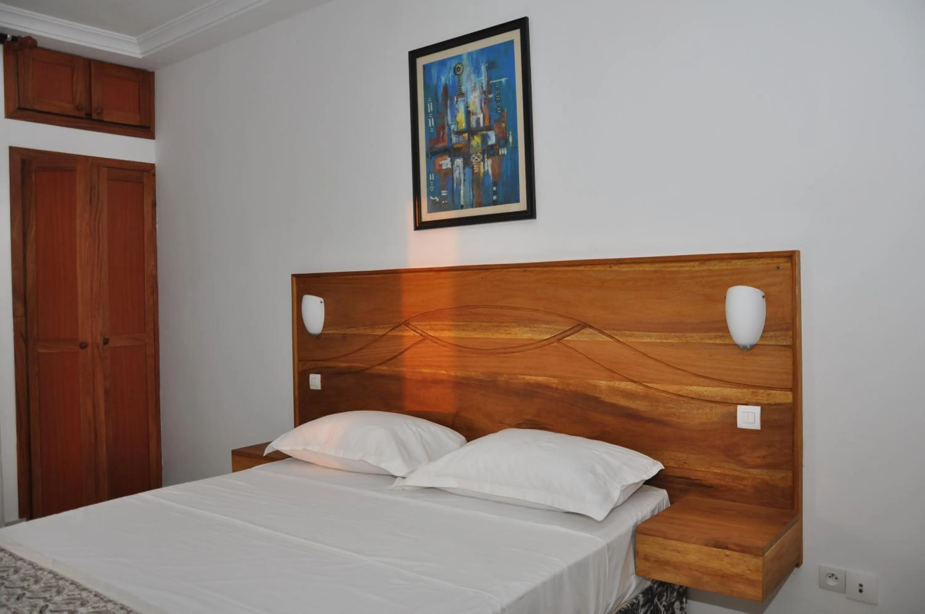 Bed in Rosalie's Suites