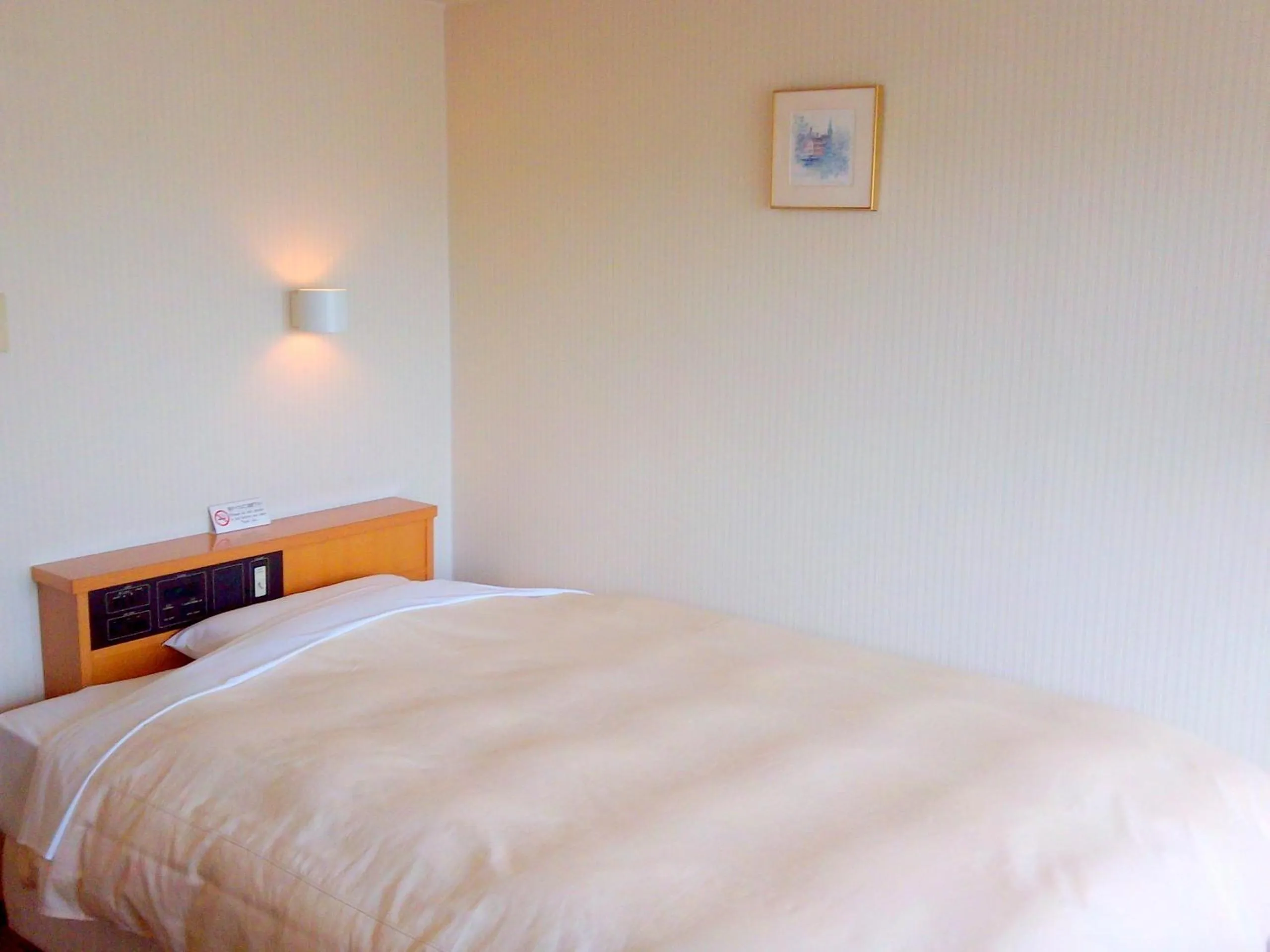 Bed in Okaya Central Hotel